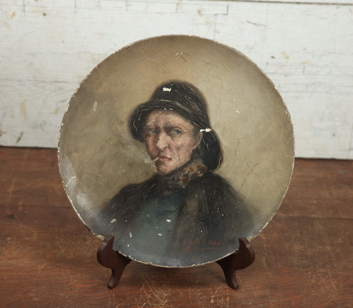 Lot 012 - Antique Painting On Shallow Wood Plate Of Man Smoking Cigarette In Hat, Artist Signed By Nellie Weise, 1888, Likely Of Her Father, "Papa"