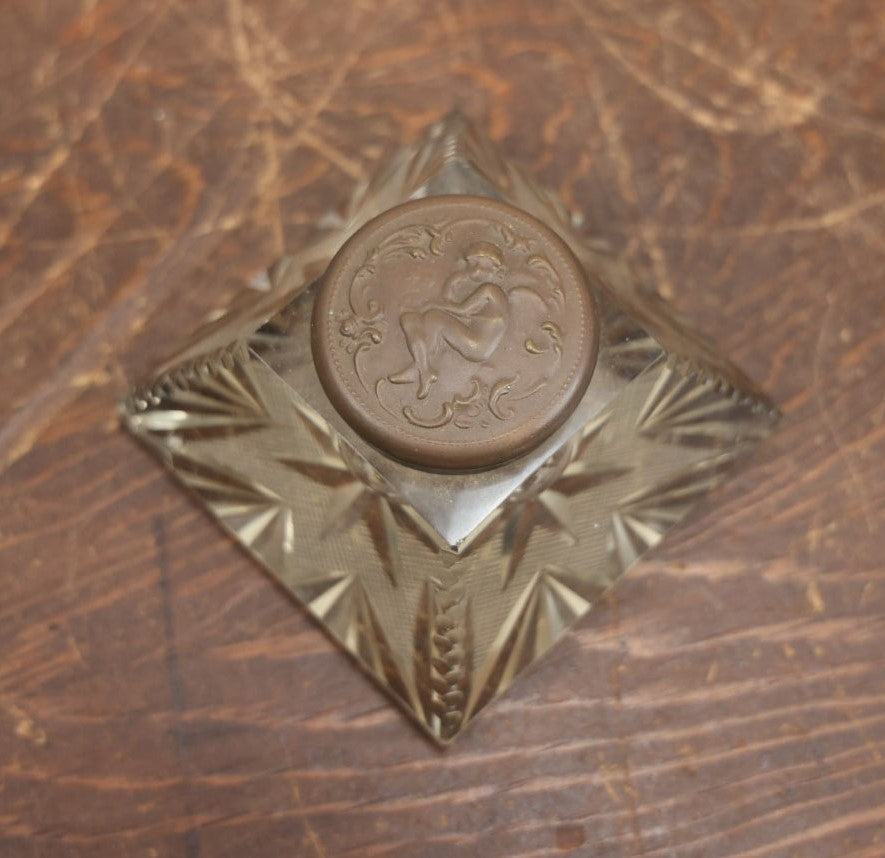 Lot 019 - Antique Cut Glass Inkwell With Brass Cherub Lift Off Lid, Note Various Chipping