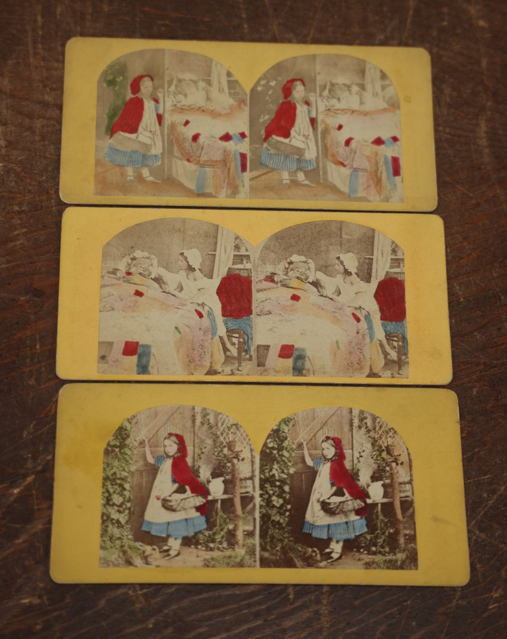 Lot 031 - Grouping Of Three Antique Stereograph Cards Of Little Red Riding Hood, From The Same Series, Featuring Taxidermy Big Bad Wolf Mount, Hand Colored