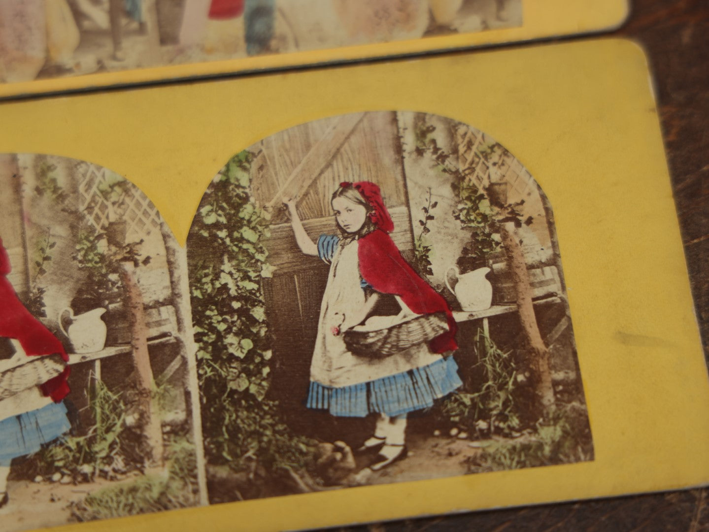 Lot 031 - Grouping Of Three Antique Stereograph Cards Of Little Red Riding Hood, From The Same Series, Featuring Taxidermy Big Bad Wolf Mount, Hand Colored