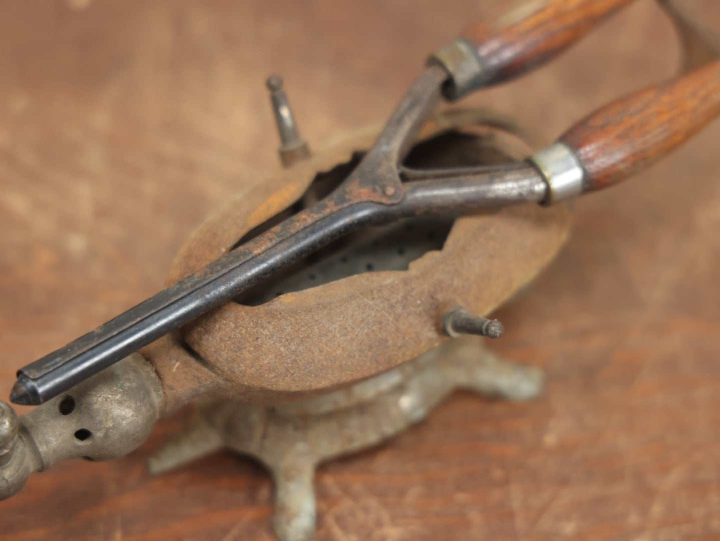 Lot 033 - Antique Cast Iron Gas Curling Iron Heater With Figural Turtle Base, Including Antique Curling Iron With Wood Handles