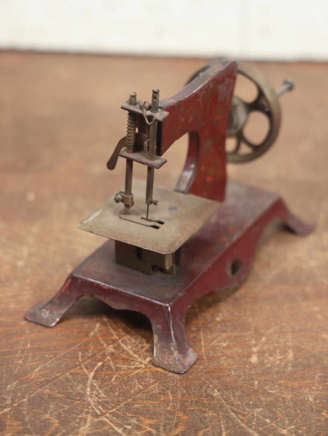 Lot 054 - Vintage Tin Lithograph Children's Miniature Sewing Machine, Red, Likely Made In Germany