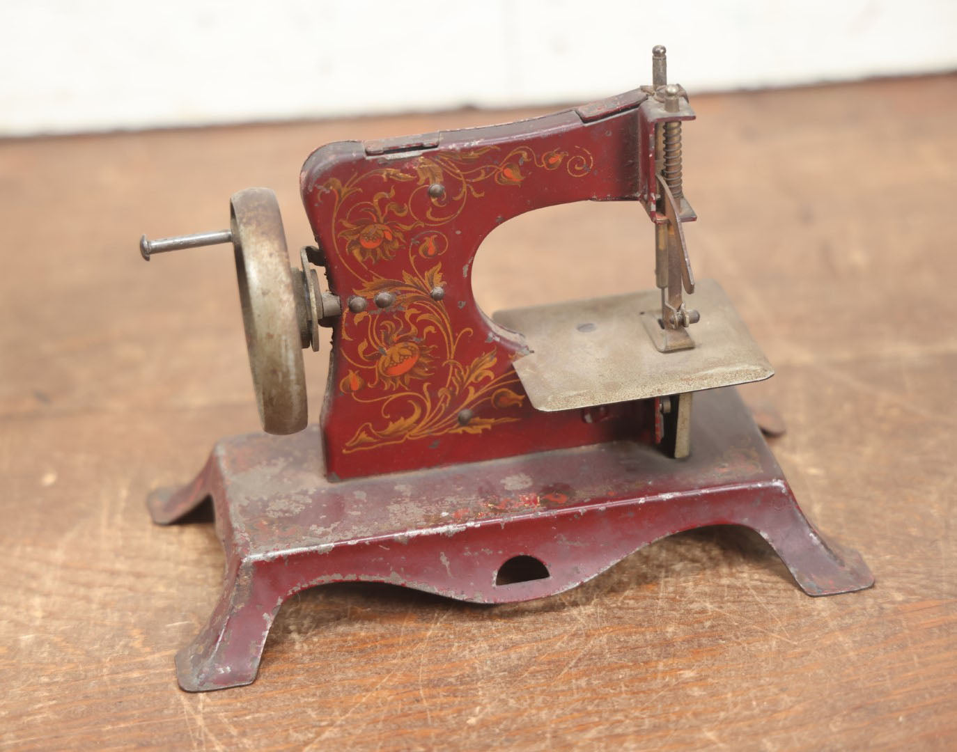 Lot 054 - Vintage Tin Lithograph Children's Miniature Sewing Machine, Red, Likely Made In Germany