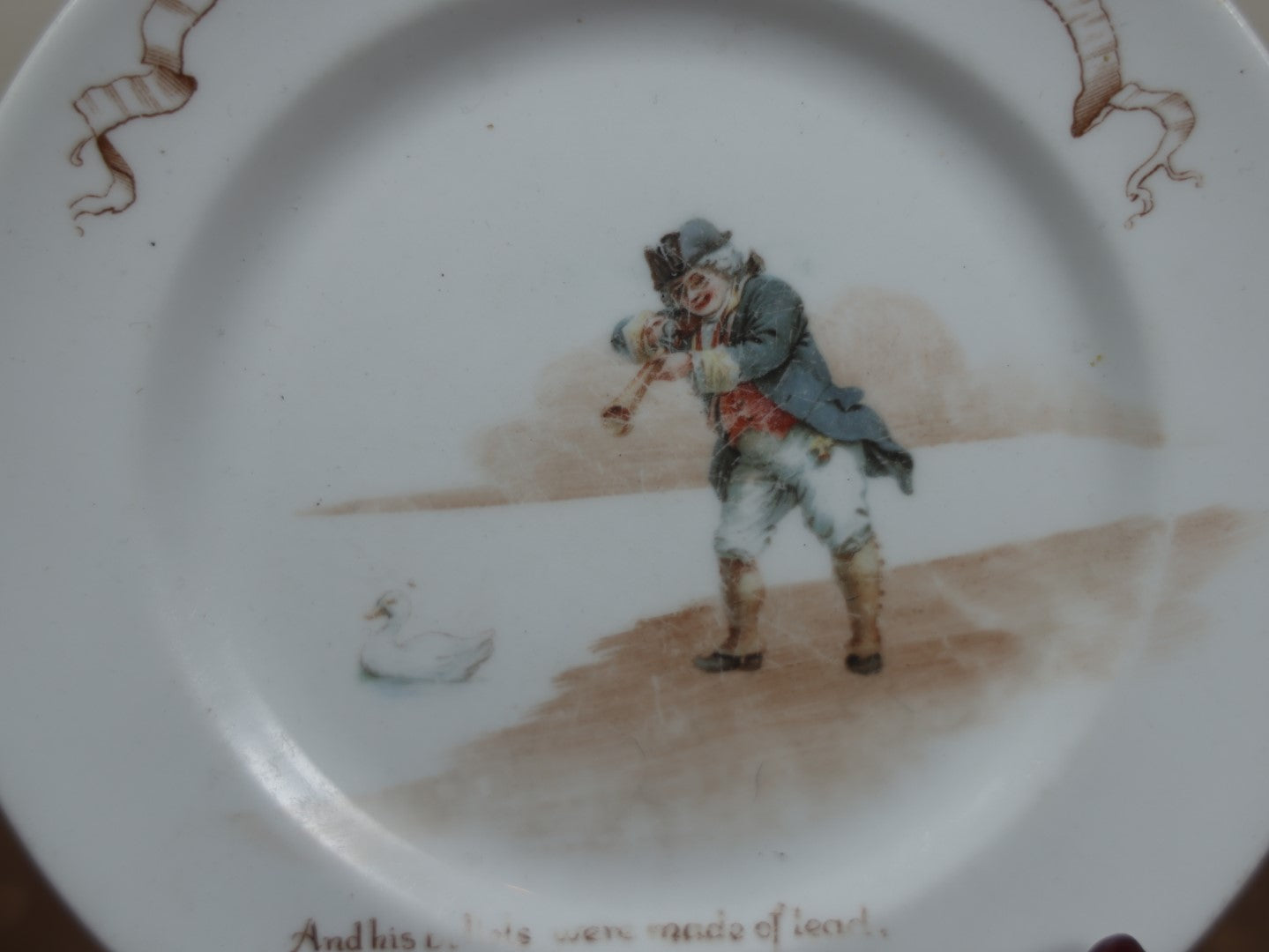 Lot 063 - Antique Novelty Nursery Rhyme Plate, A Little Man Shooting A Little Duck Right Through Its Little Head, Royal Doulton, England