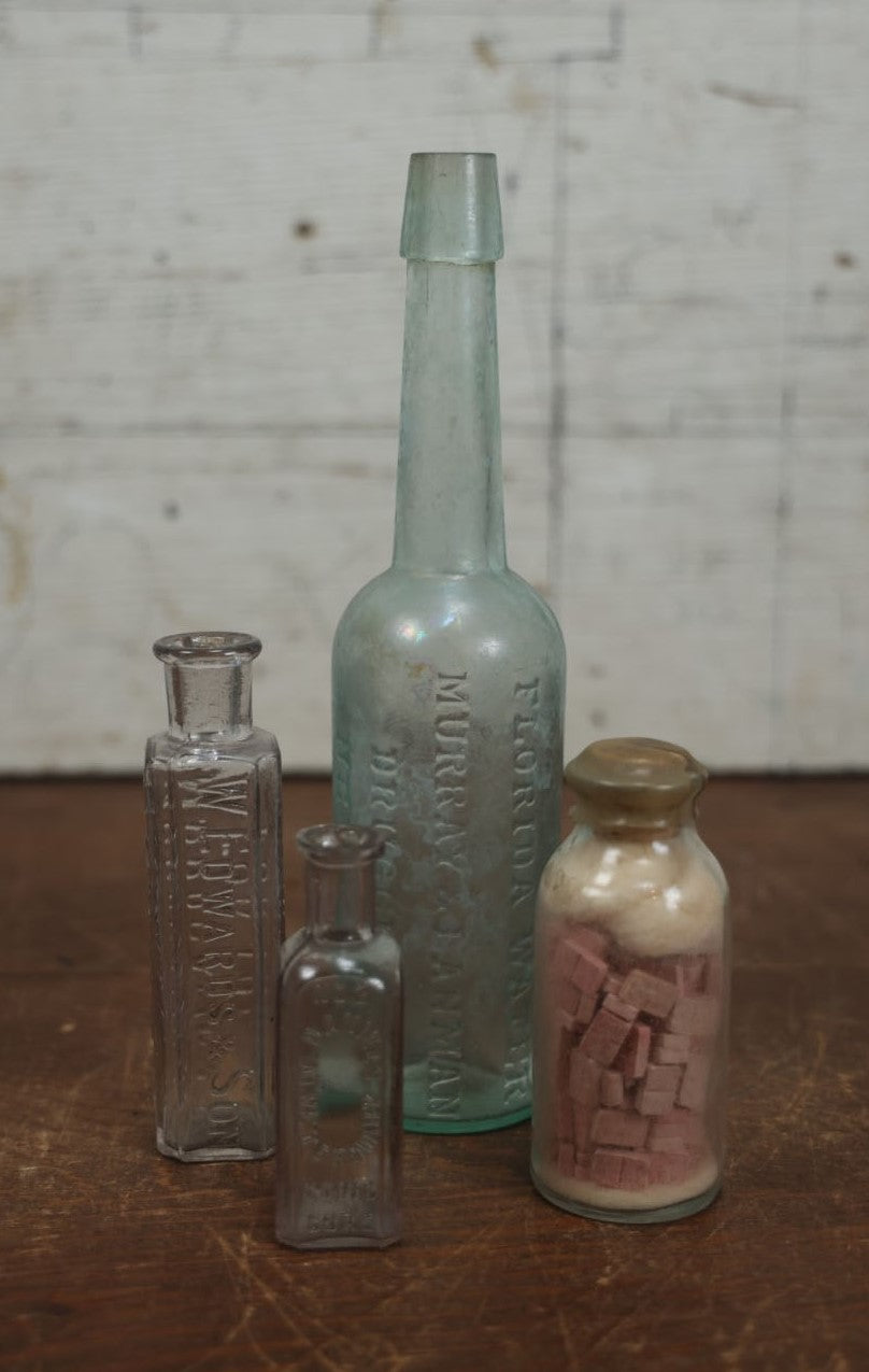 Lot 072 - Grouping Of Four Antique And Vintage Apothecary And Pharmacy Bottles - Florida Water, Upjohn Friable Pills, Daniels Veterinary Colic Cure, Roche's Hooping Cough