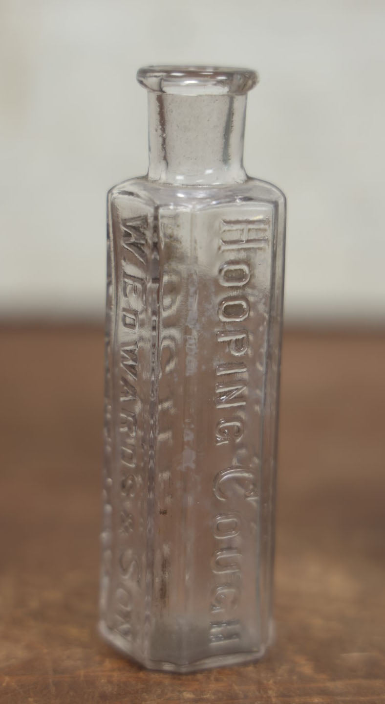 Lot 072 - Grouping Of Four Antique And Vintage Apothecary And Pharmacy Bottles - Florida Water, Upjohn Friable Pills, Daniels Veterinary Colic Cure, Roche's Hooping Cough