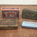Lot 074 - Grouping Of Four Antique And Vintage Tins And Boxes - Birds Eye Matches, Idle Hour Cut Plug Tobacco, Rubicon Smoking Mixture, Rexall Orderlies Laxative