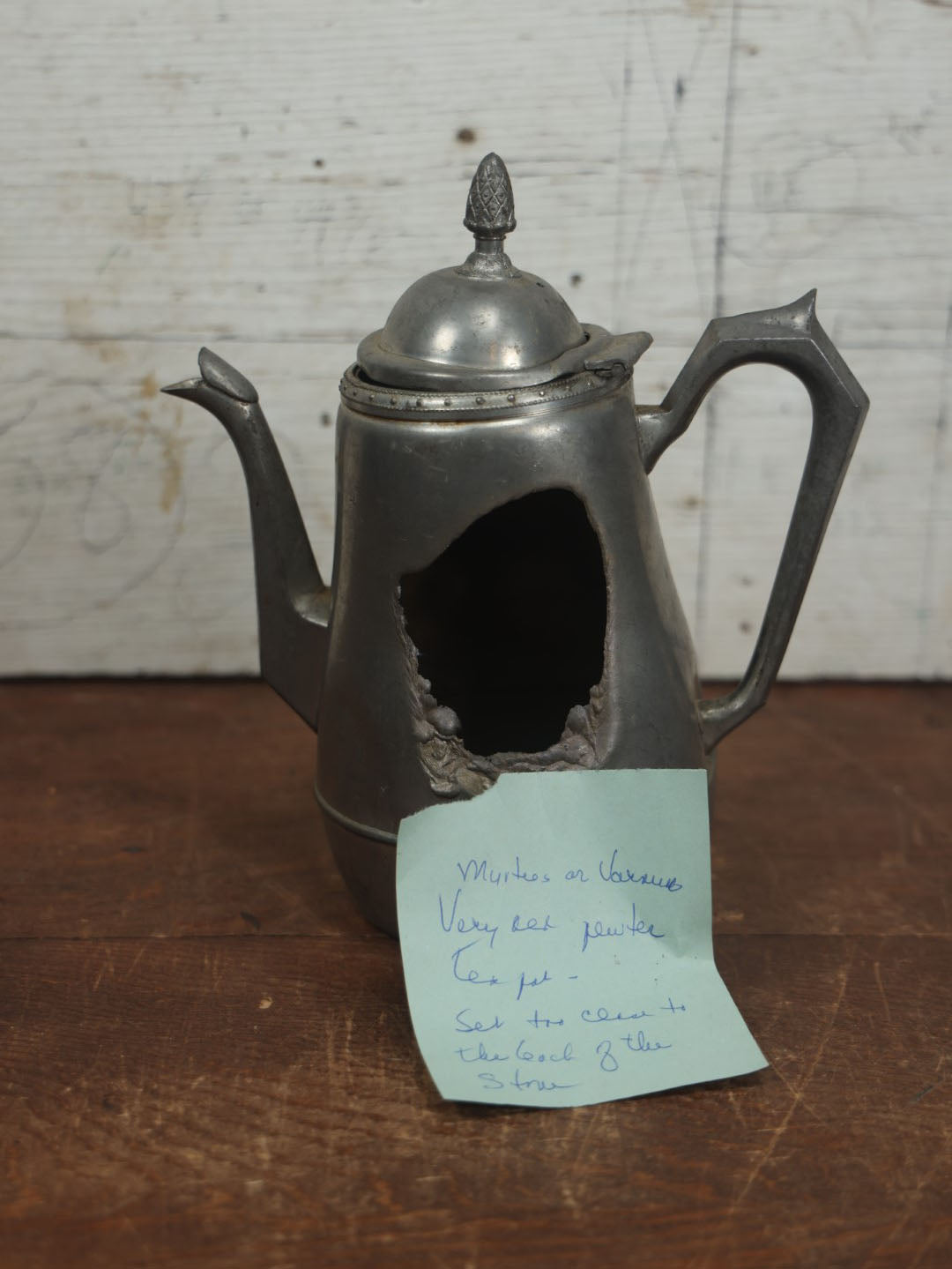 Lot 075 - Antique Pewter Pitcher With Melted Side And Note Indicating A Previous Owner Set It Too Close To The Stove