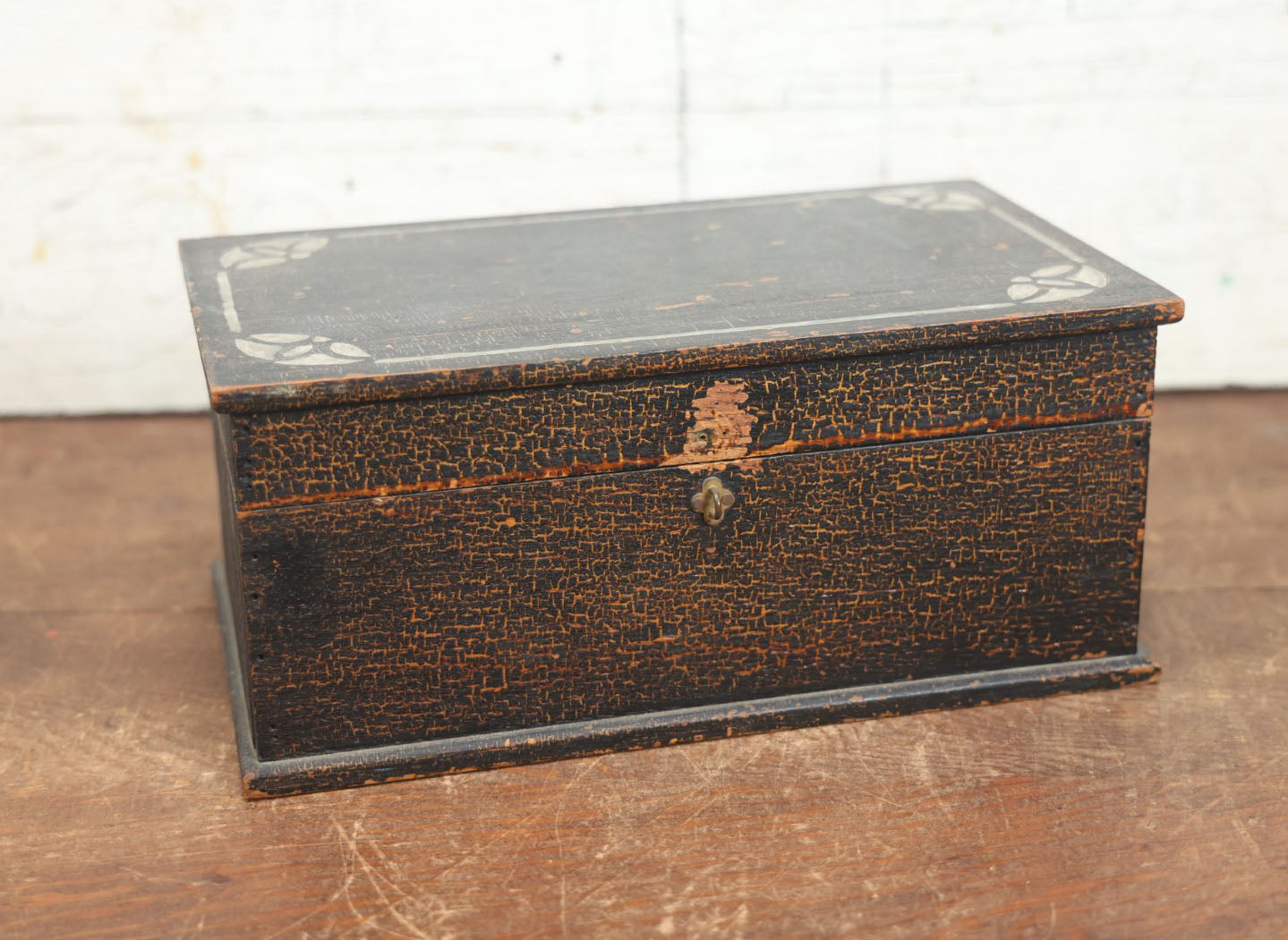 Lot 080 - Antique Black Painted And Stenciled Wooden Storage Box With Hinged Lid