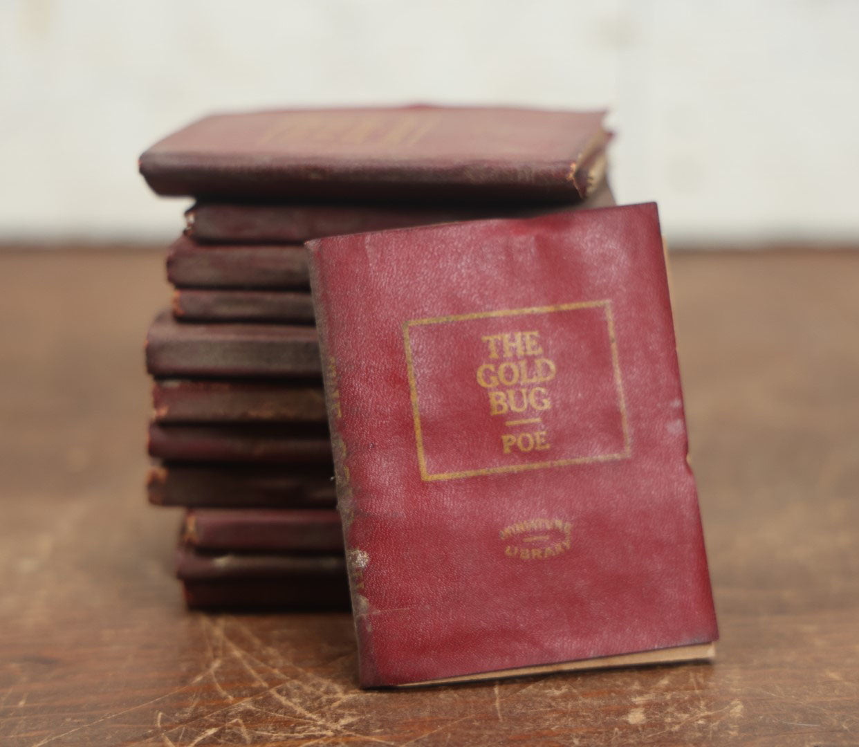 Lot 089 - Grouping Of Thirteen Antique Miniature Library Books, Red Group, Including Edgar Allan Poe's "The Gold Bug,"  R.L. Stevenson's "Dr. Jekyll And Mr. Hyde," Shakespeare And More, Note Wear, Dirty