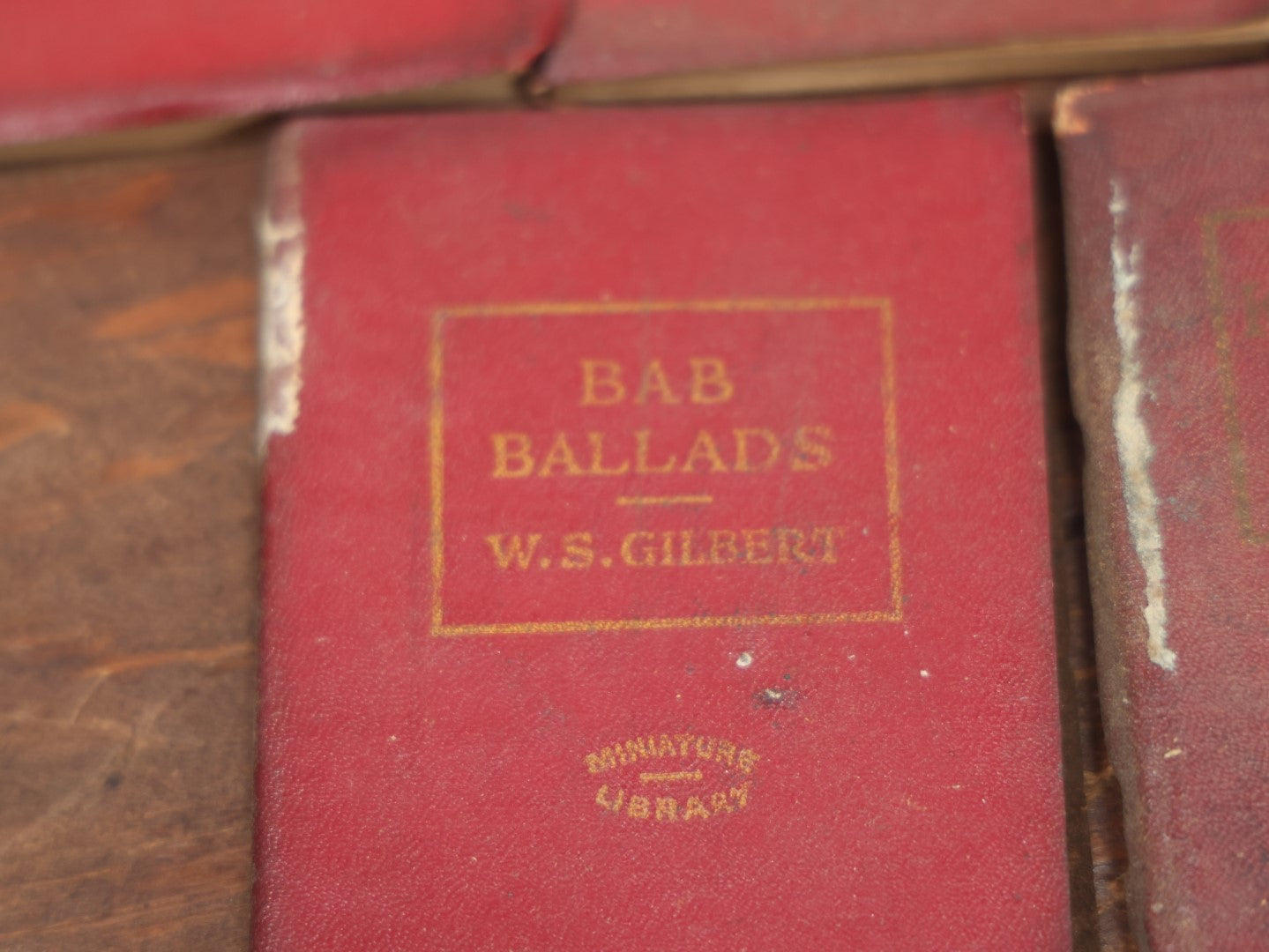 Lot 089 - Grouping Of Thirteen Antique Miniature Library Books, Red Group, Including Edgar Allan Poe's "The Gold Bug,"  R.L. Stevenson's "Dr. Jekyll And Mr. Hyde," Shakespeare And More, Note Wear, Dirty