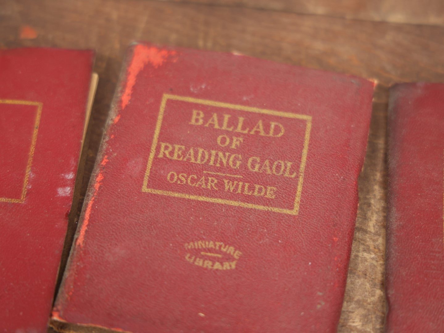 Lot 089 - Grouping Of Thirteen Antique Miniature Library Books, Red Group, Including Edgar Allan Poe's "The Gold Bug,"  R.L. Stevenson's "Dr. Jekyll And Mr. Hyde," Shakespeare And More, Note Wear, Dirty