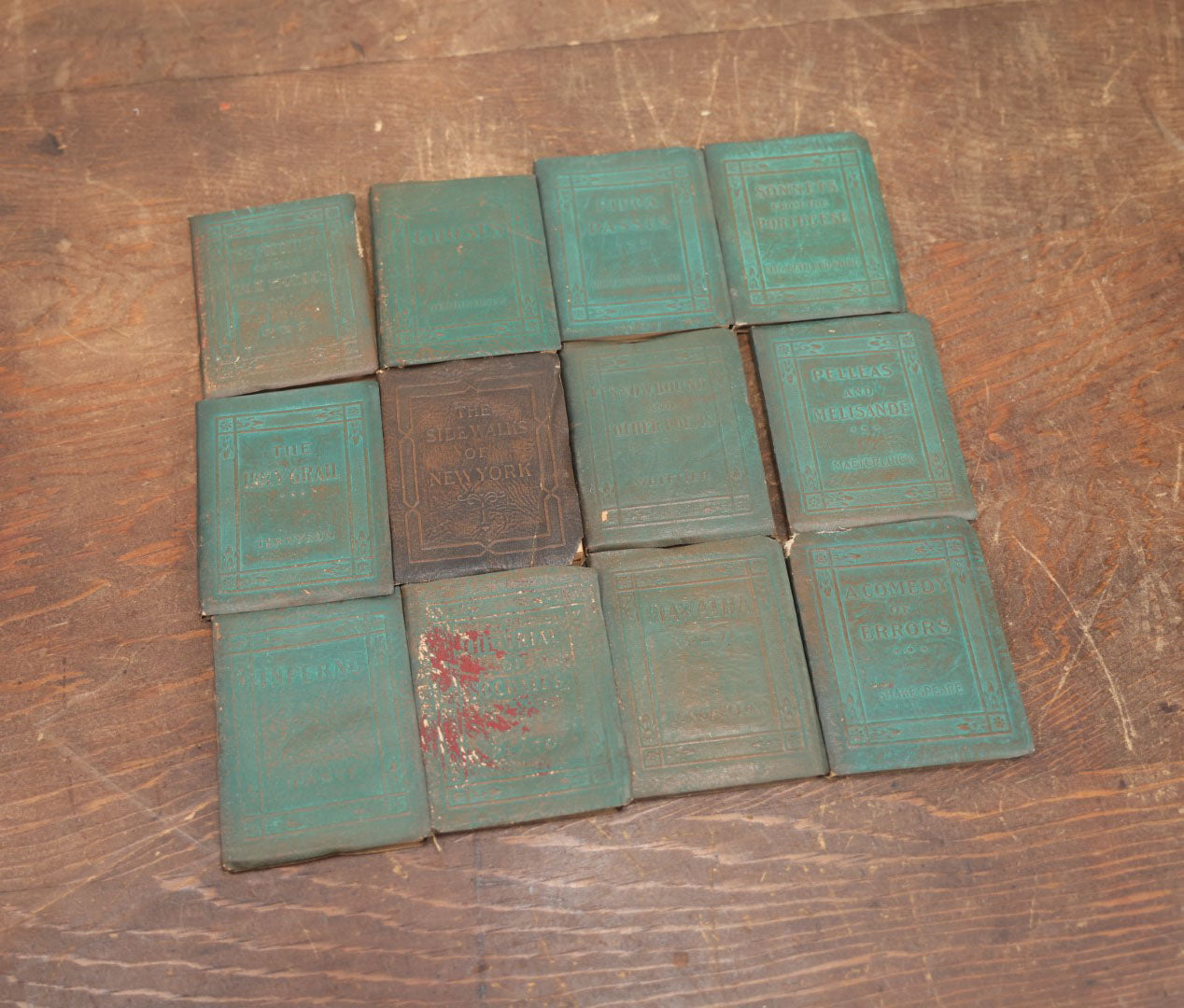 Lot 090 - Grouping Of Twelve Antique Miniature Library Books, Green Group, Including Edgar Allan Poe's "Murders In Rue Morgue,"  "The Sidewalks Of New York," Henrik Ibsen's "Ghosts" And More