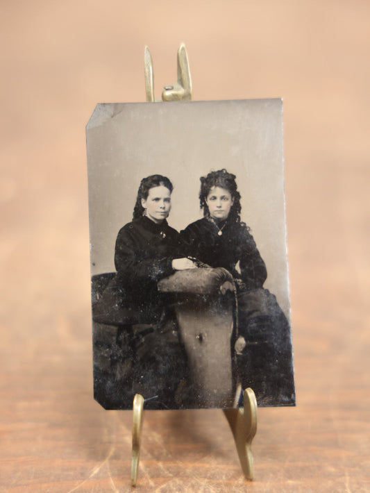 Lot 099 - Antique Tintype Photograph Of Two Pretty Young Women, One With Large Hair, Necklaces, Sitting On Chair