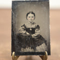 Lot 100 - Antique Tintype Photograph Of Young Girl With Cleft Chin, Slight Smile, Necklace, Sitting In Chair