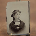 Lot 101 - Antique Tintype Photo Of Young Woman With Necklace Pendant, Curly Bangs, White Ruffle, Possibly Redhead