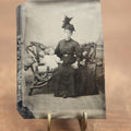 Lot 104 - Antique Tintype Photo Of Mother With Big Hat And Child Sitting On Adirondack Bench With Beach, Boardwalk Backdrop