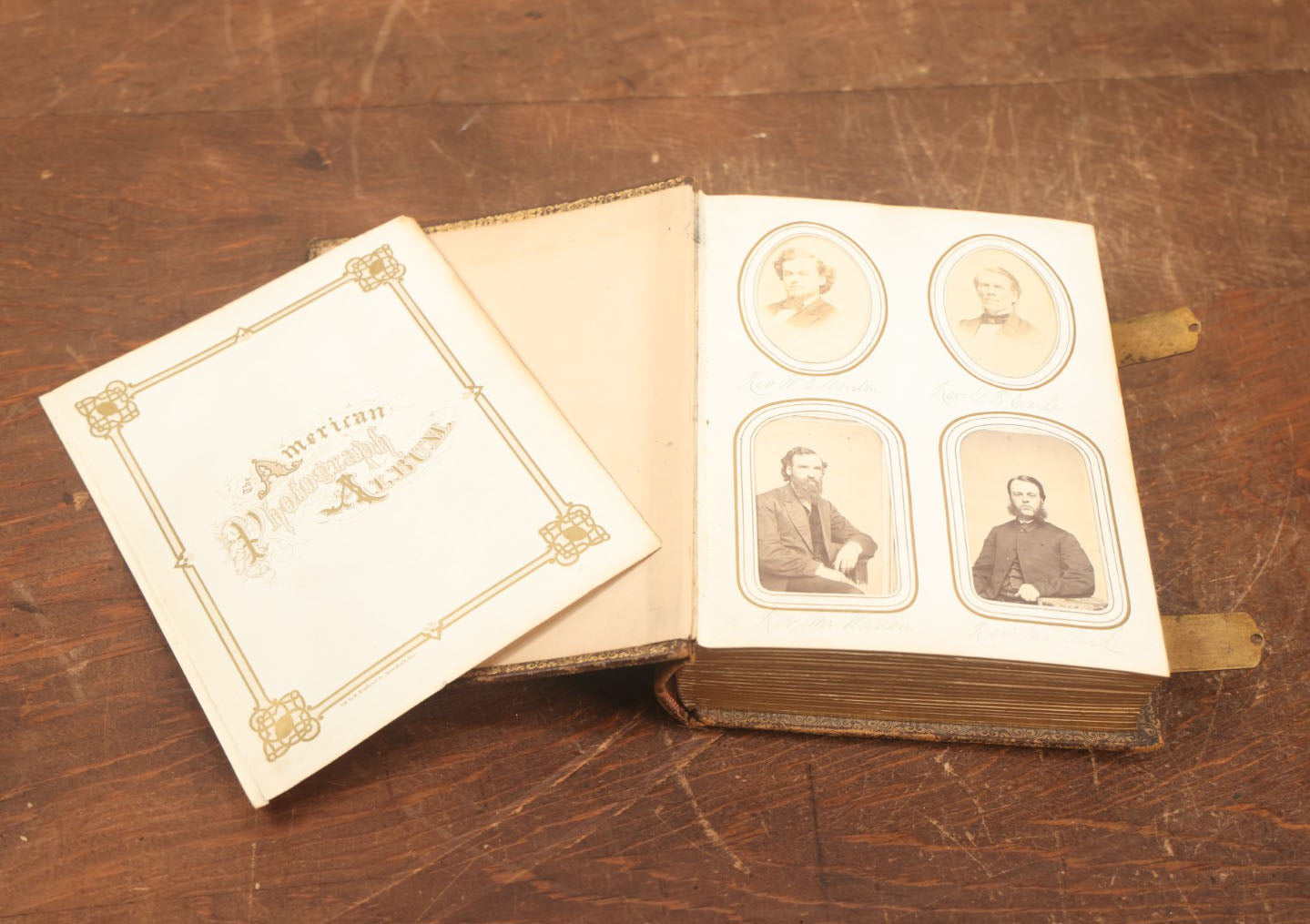 Lot 027 - Antique Family Photograph Album With 36 C.D.V. Photos, 9 Tintypes, And 27 Illustrated Filler Cards Of Various Scenes, Characters, Pretty Women