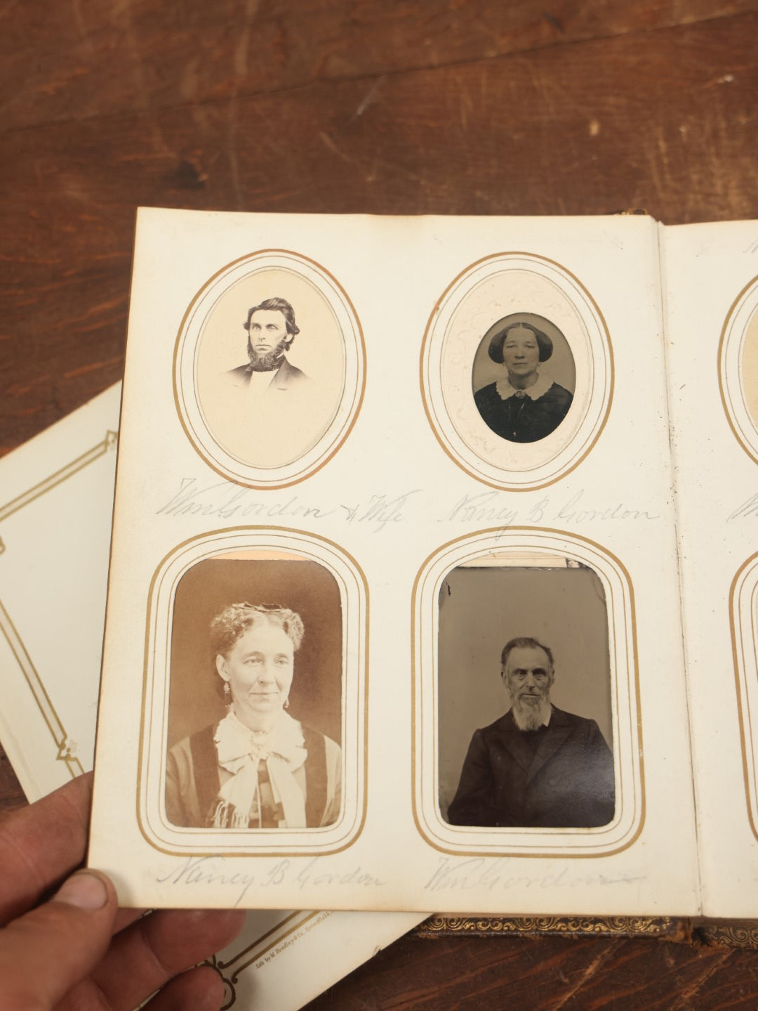 Lot 027 - Antique Family Photograph Album With 36 C.D.V. Photos, 9 Tintypes, And 27 Illustrated Filler Cards Of Various Scenes, Characters, Pretty Women