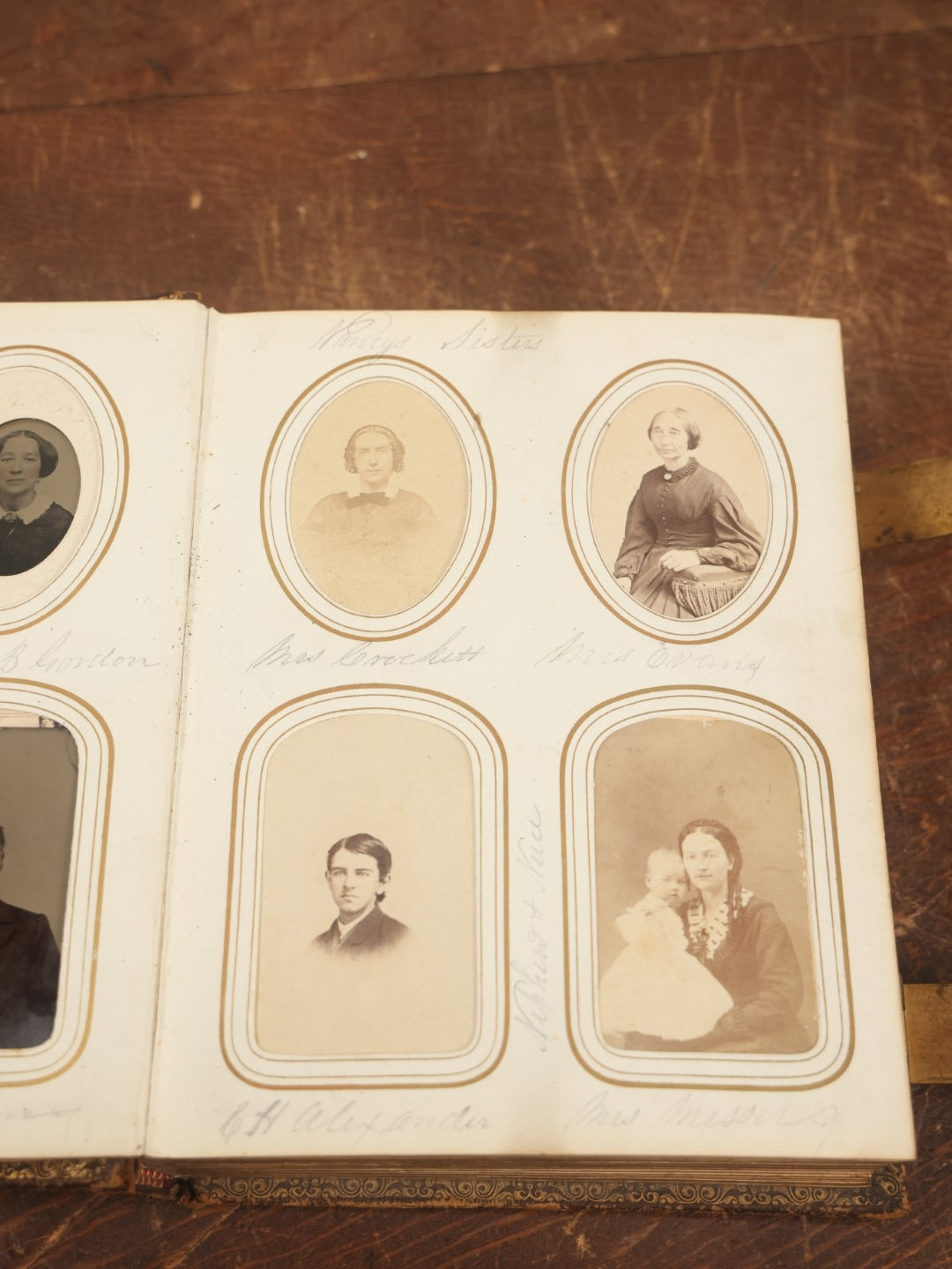 Lot 027 - Antique Family Photograph Album With 36 C.D.V. Photos, 9 Tintypes, And 27 Illustrated Filler Cards Of Various Scenes, Characters, Pretty Women