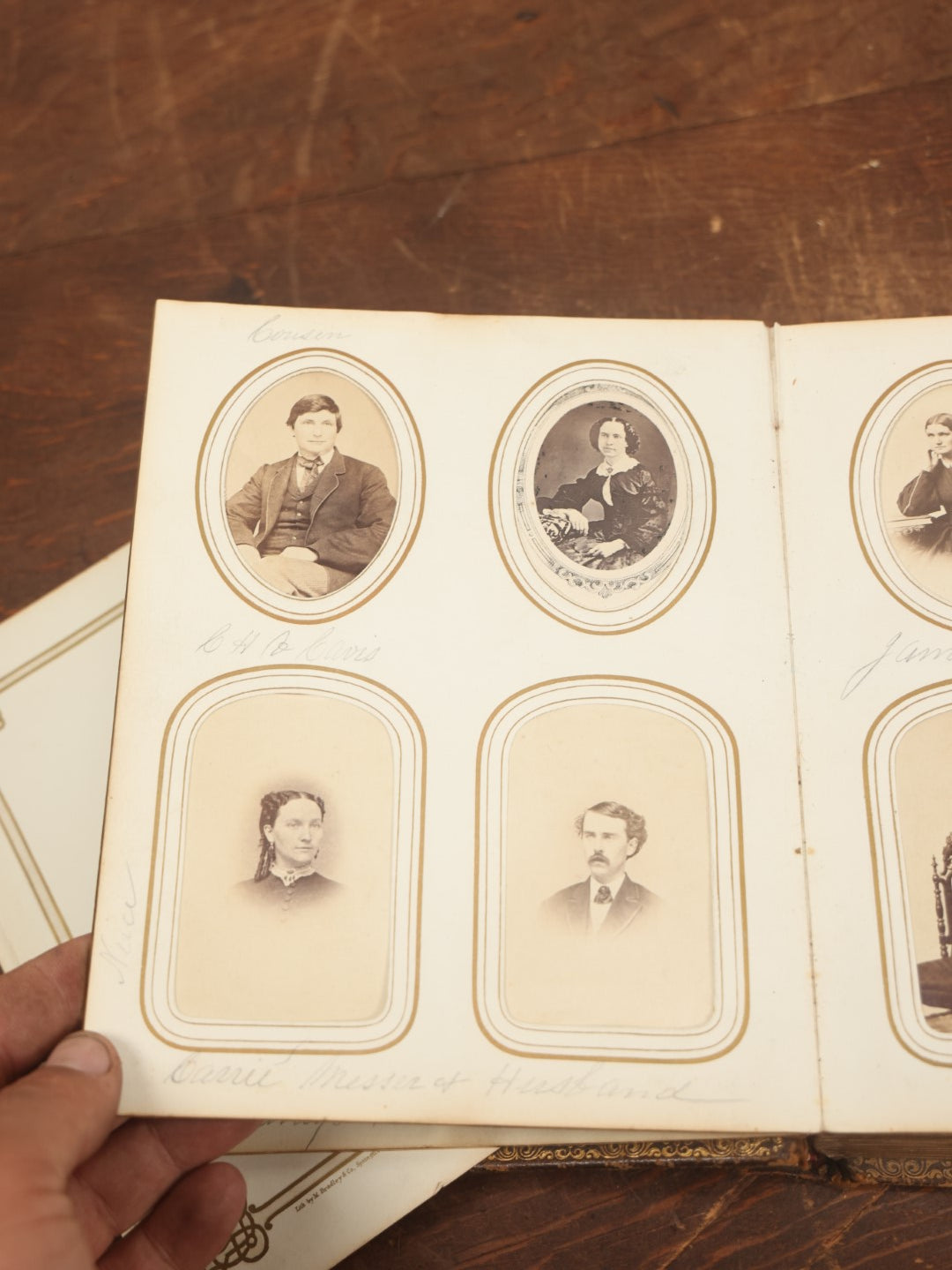 Lot 027 - Antique Family Photograph Album With 36 C.D.V. Photos, 9 Tintypes, And 27 Illustrated Filler Cards Of Various Scenes, Characters, Pretty Women