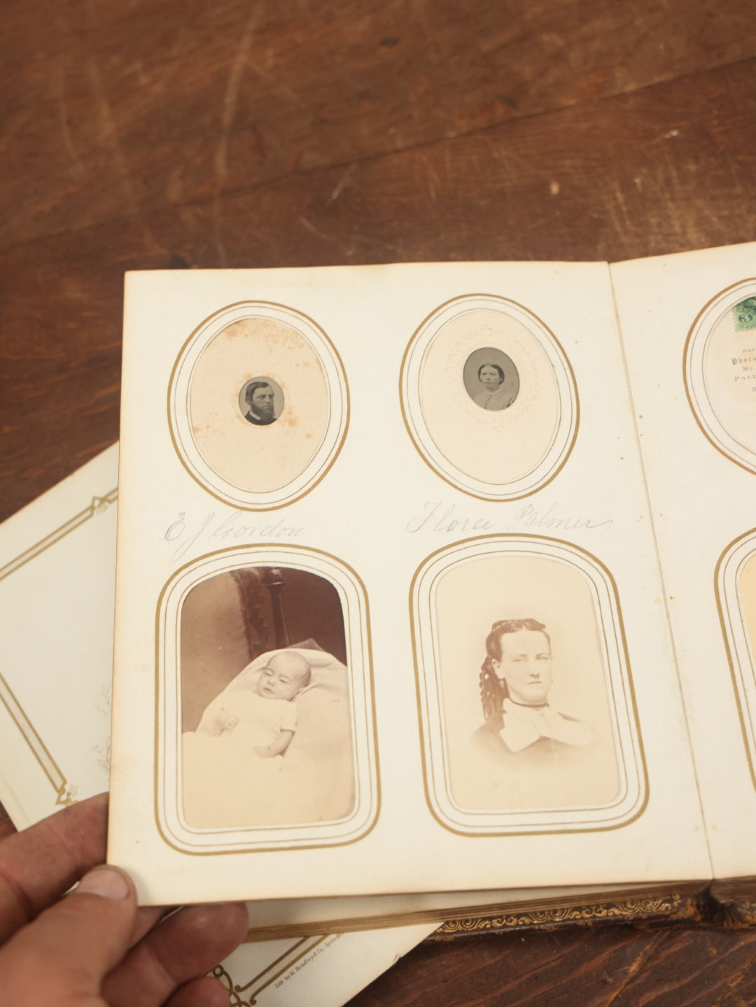 Lot 027 - Antique Family Photograph Album With 36 C.D.V. Photos, 9 Tintypes, And 27 Illustrated Filler Cards Of Various Scenes, Characters, Pretty Women