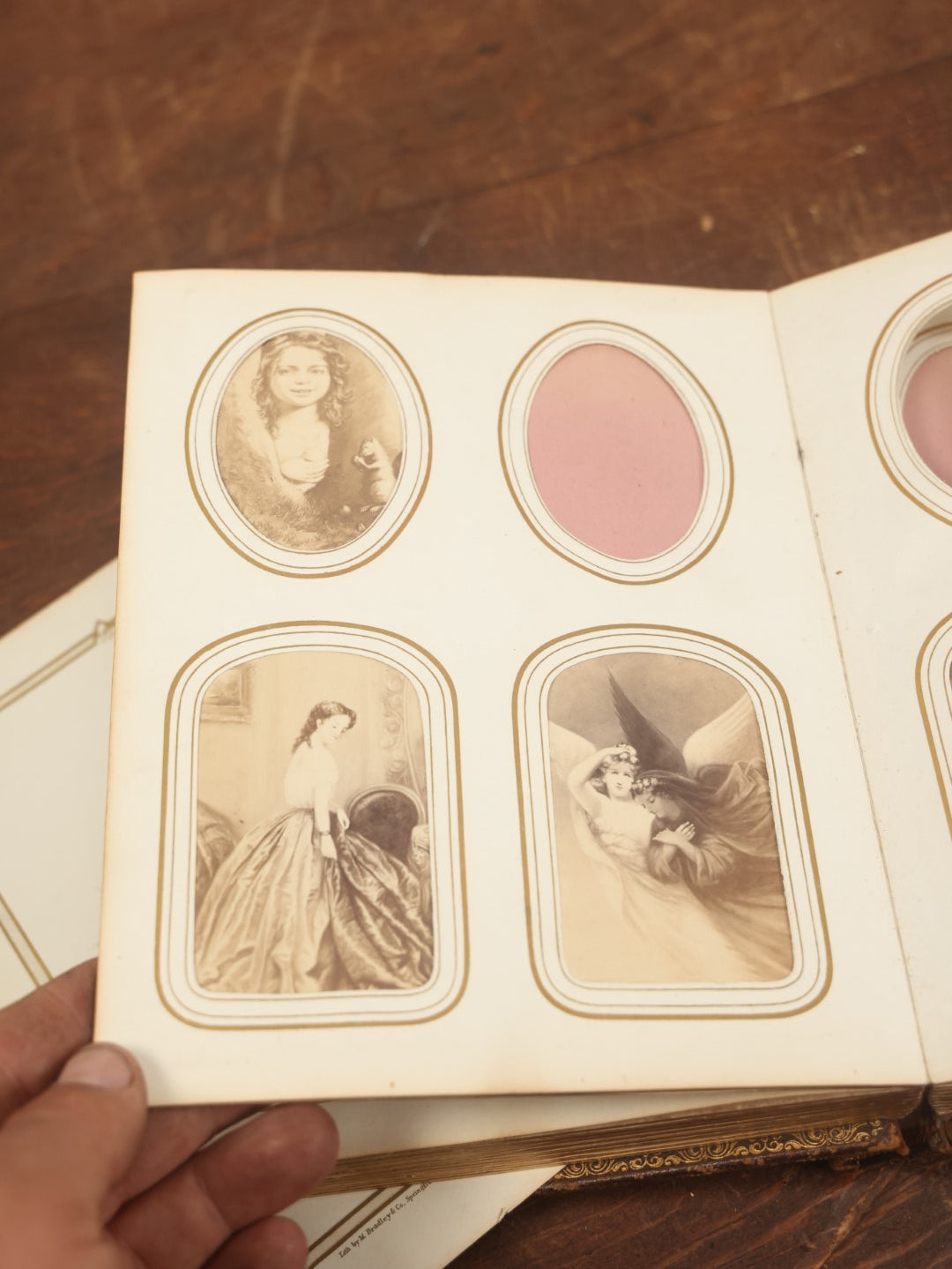 Lot 027 - Antique Family Photograph Album With 36 C.D.V. Photos, 9 Tintypes, And 27 Illustrated Filler Cards Of Various Scenes, Characters, Pretty Women