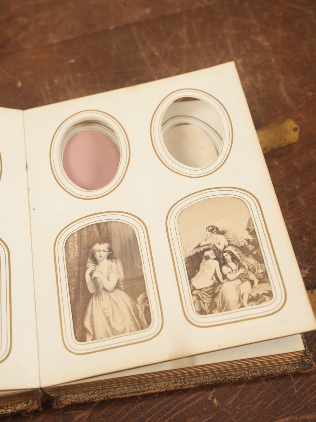 Lot 027 - Antique Family Photograph Album With 36 C.D.V. Photos, 9 Tintypes, And 27 Illustrated Filler Cards Of Various Scenes, Characters, Pretty Women