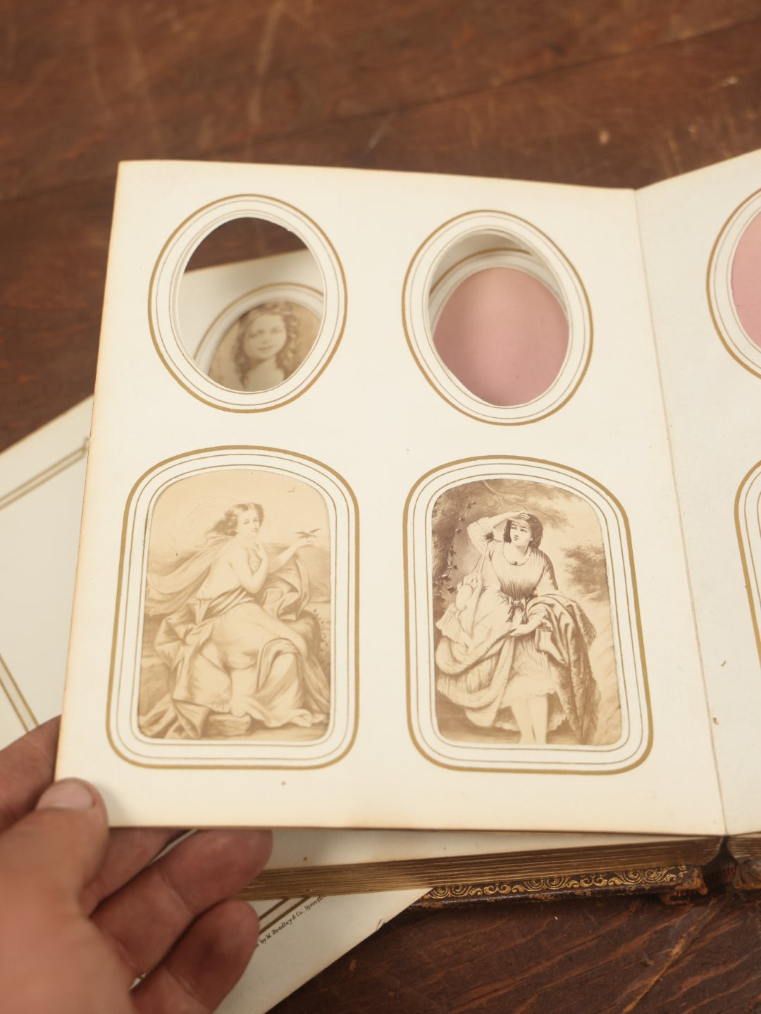 Lot 027 - Antique Family Photograph Album With 36 C.D.V. Photos, 9 Tintypes, And 27 Illustrated Filler Cards Of Various Scenes, Characters, Pretty Women