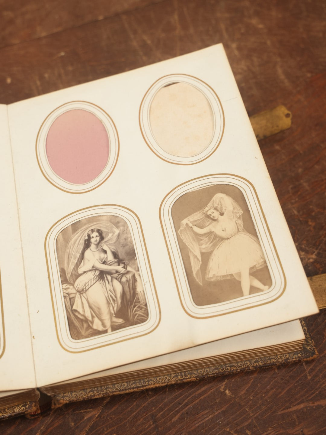 Lot 027 - Antique Family Photograph Album With 36 C.D.V. Photos, 9 Tintypes, And 27 Illustrated Filler Cards Of Various Scenes, Characters, Pretty Women