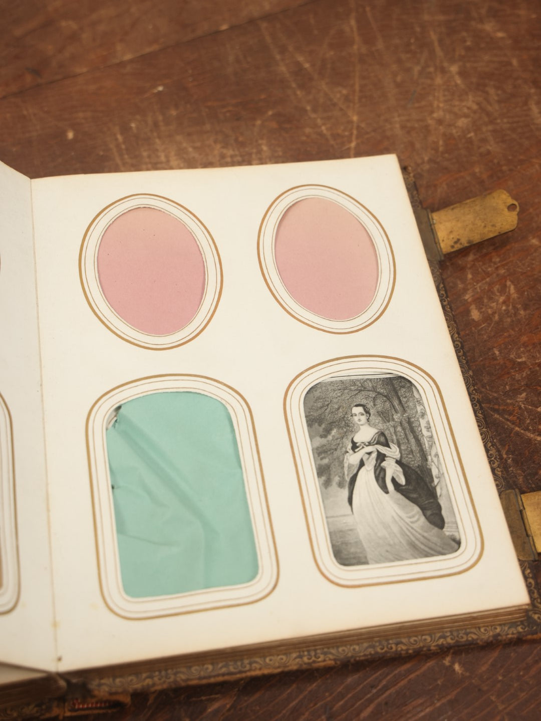 Lot 027 - Antique Family Photograph Album With 36 C.D.V. Photos, 9 Tintypes, And 27 Illustrated Filler Cards Of Various Scenes, Characters, Pretty Women