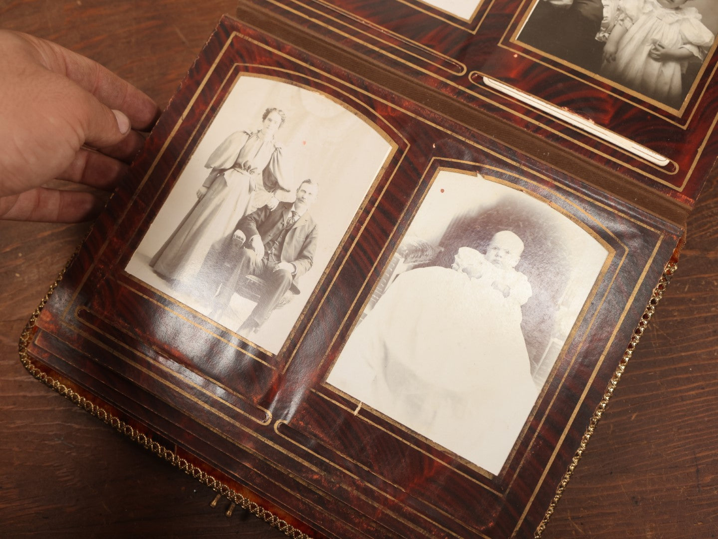 Lot 028 - Antique Family Photograph Album With Velvet Covering And Beveled Glass Heart Mirror, Containing 34 Cabinet Card Photos, 10 C.D.V.S, 1 Tintype, And 23 Paper Portrait Snapshots