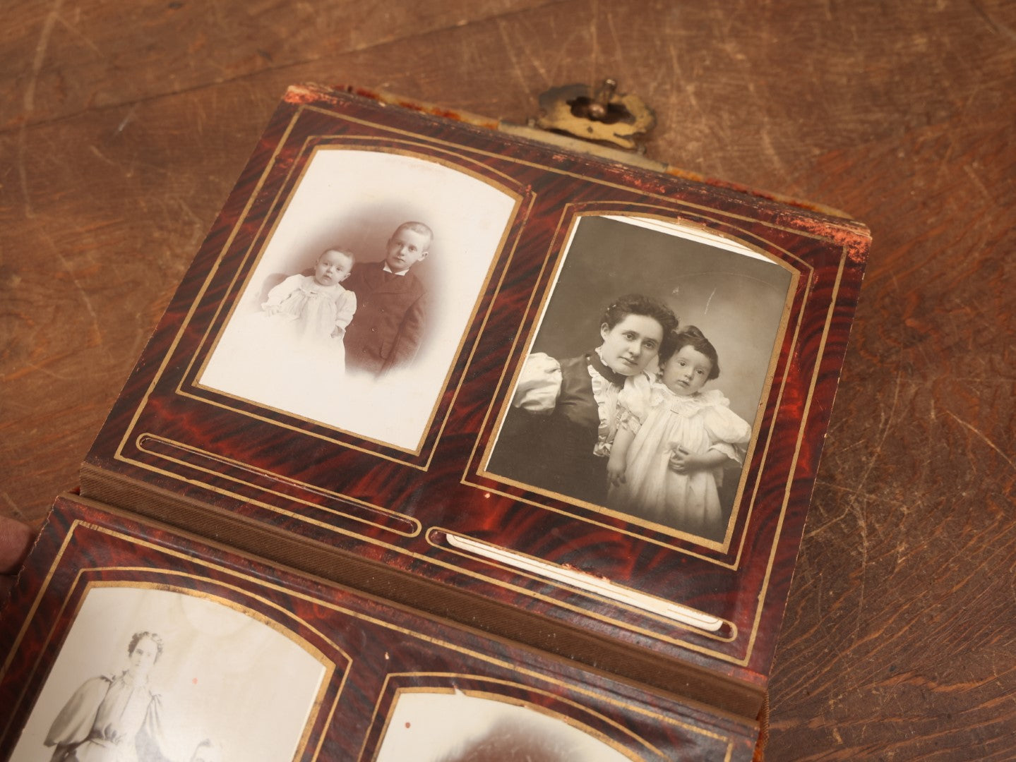 Lot 028 - Antique Family Photograph Album With Velvet Covering And Beveled Glass Heart Mirror, Containing 34 Cabinet Card Photos, 10 C.D.V.S, 1 Tintype, And 23 Paper Portrait Snapshots