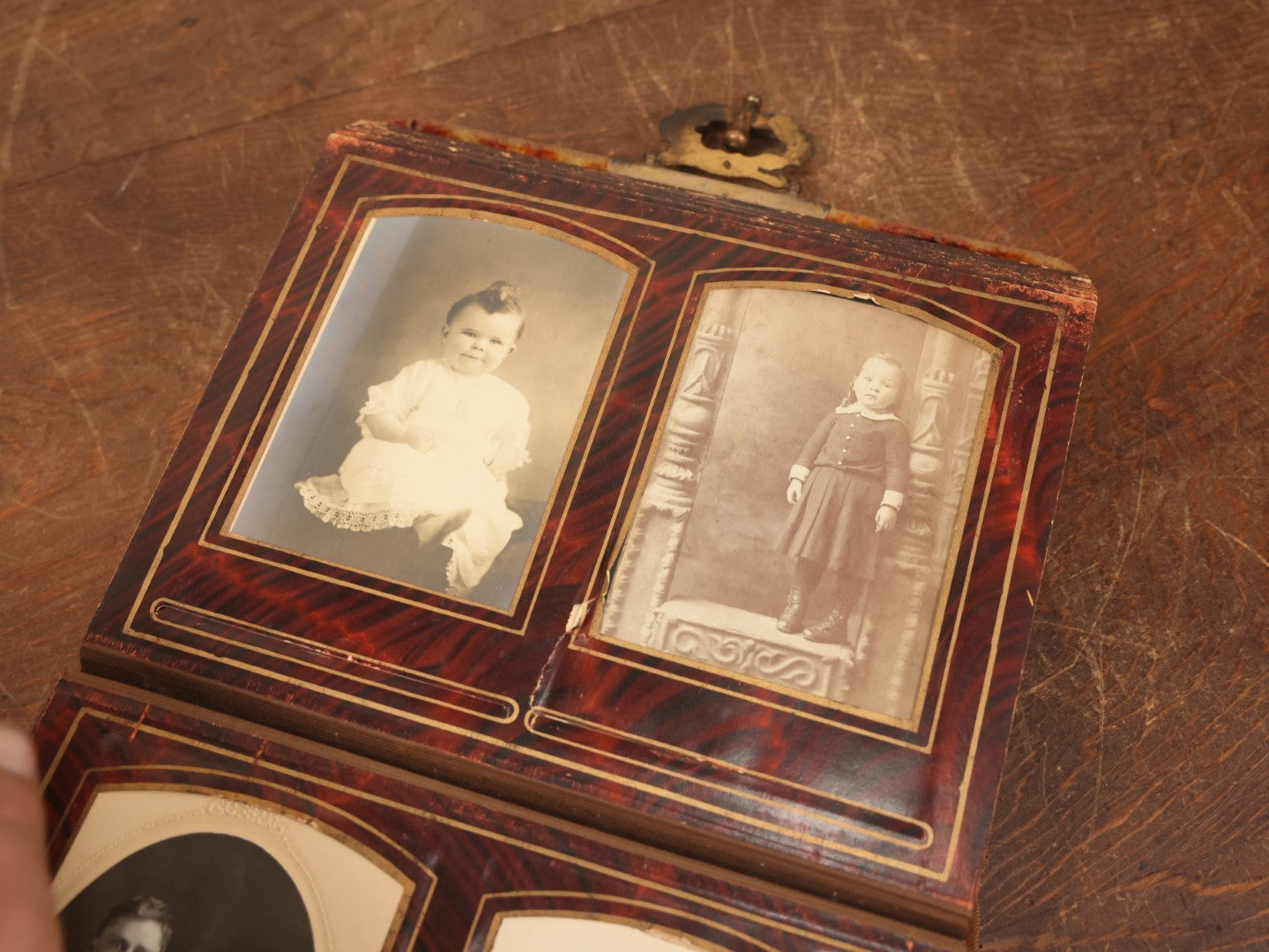 Lot 028 - Antique Family Photograph Album With Velvet Covering And Beveled Glass Heart Mirror, Containing 34 Cabinet Card Photos, 10 C.D.V.S, 1 Tintype, And 23 Paper Portrait Snapshots