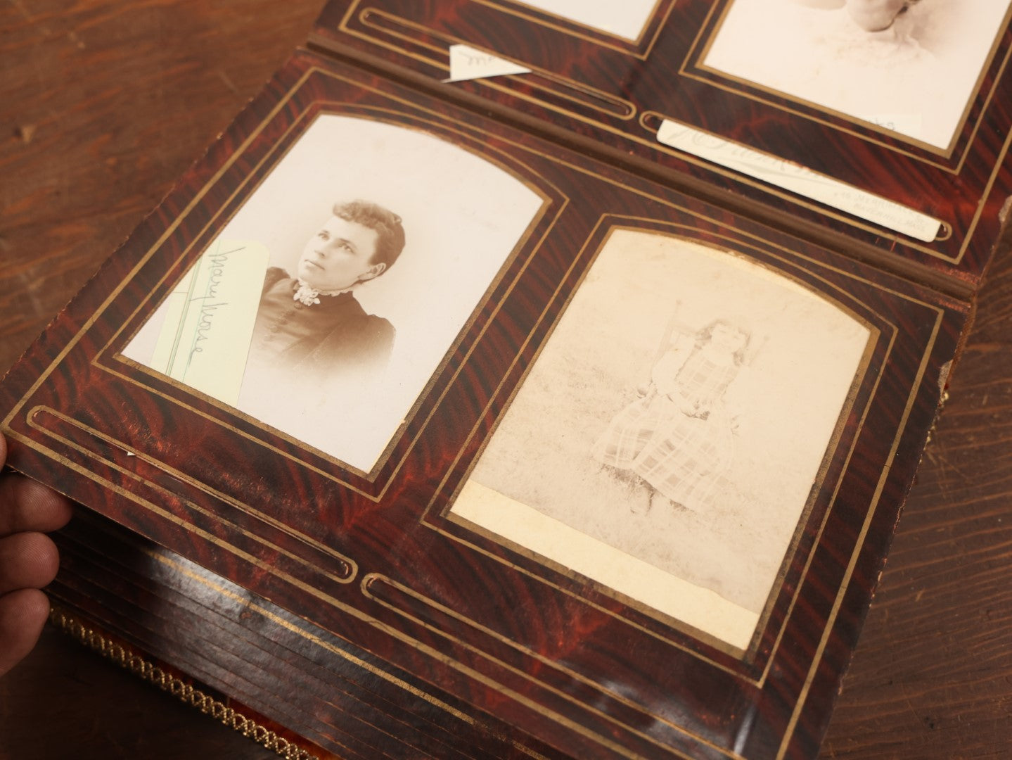 Lot 028 - Antique Family Photograph Album With Velvet Covering And Beveled Glass Heart Mirror, Containing 34 Cabinet Card Photos, 10 C.D.V.S, 1 Tintype, And 23 Paper Portrait Snapshots