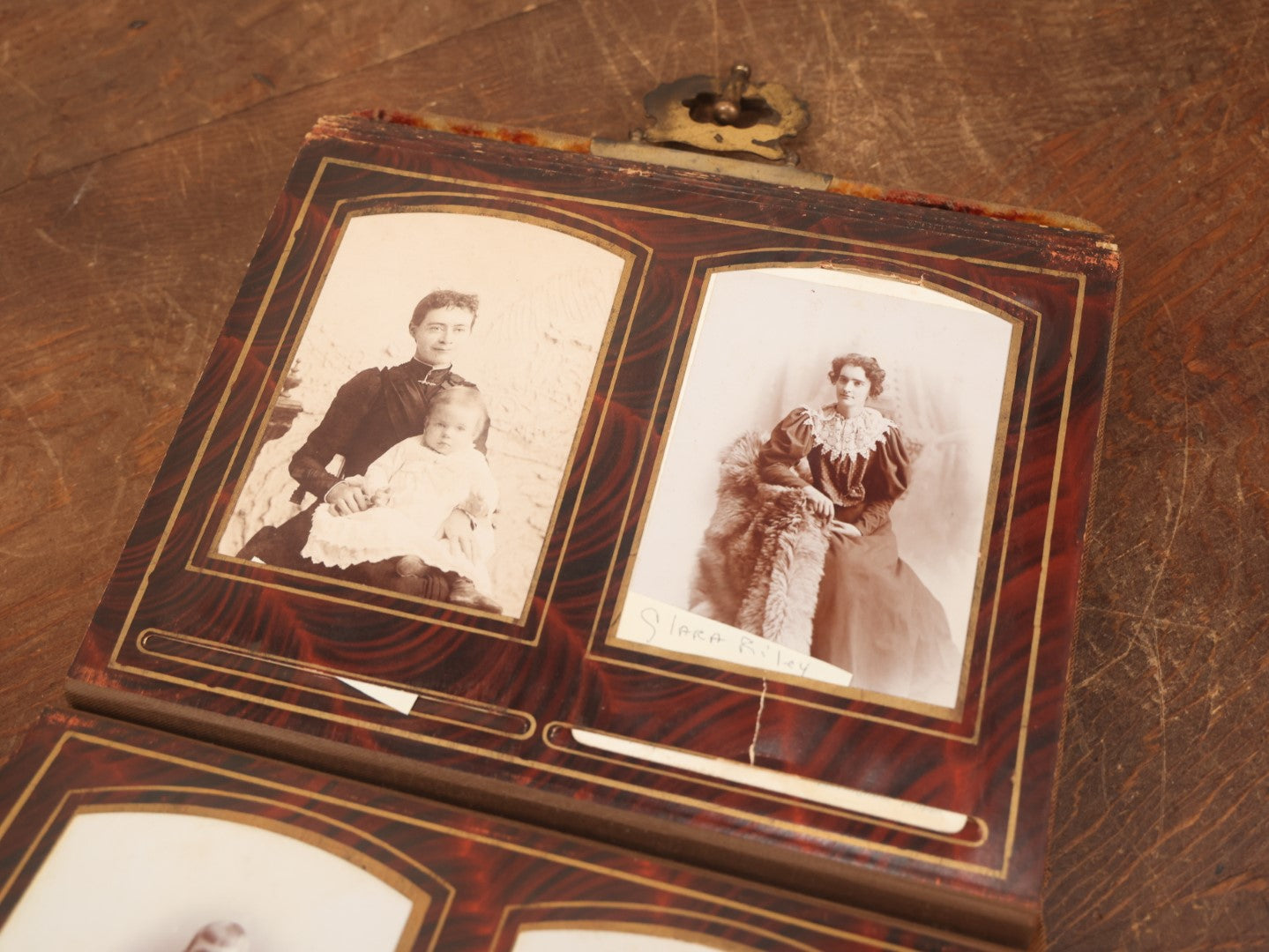 Lot 028 - Antique Family Photograph Album With Velvet Covering And Beveled Glass Heart Mirror, Containing 34 Cabinet Card Photos, 10 C.D.V.S, 1 Tintype, And 23 Paper Portrait Snapshots