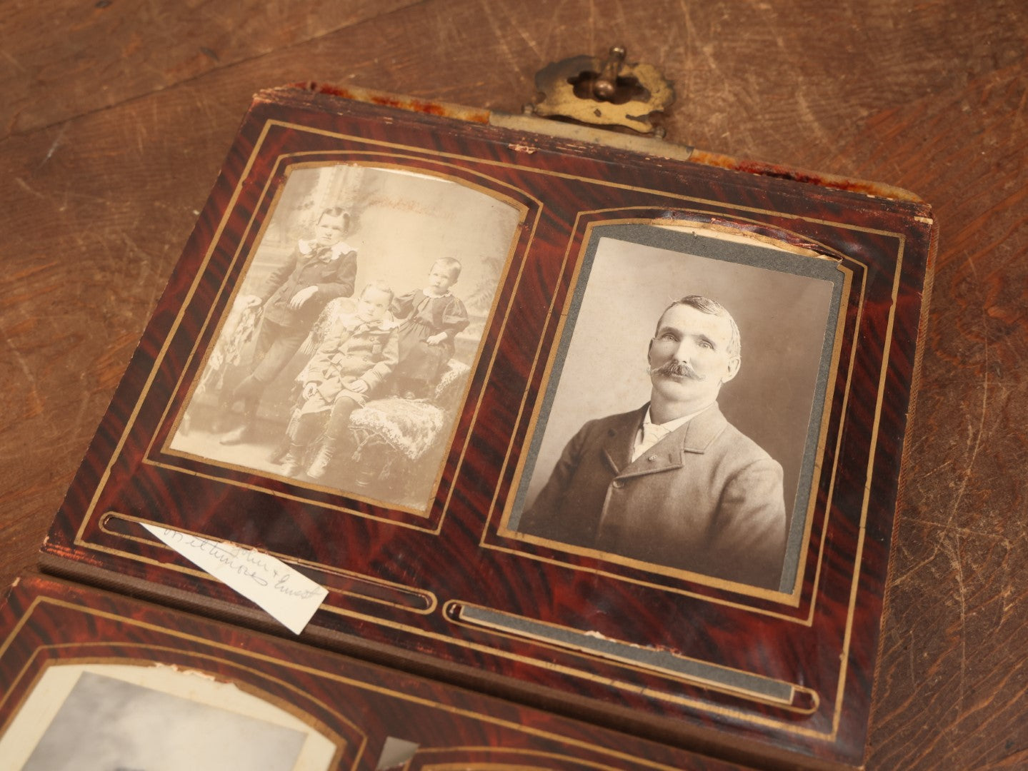 Lot 028 - Antique Family Photograph Album With Velvet Covering And Beveled Glass Heart Mirror, Containing 34 Cabinet Card Photos, 10 C.D.V.S, 1 Tintype, And 23 Paper Portrait Snapshots