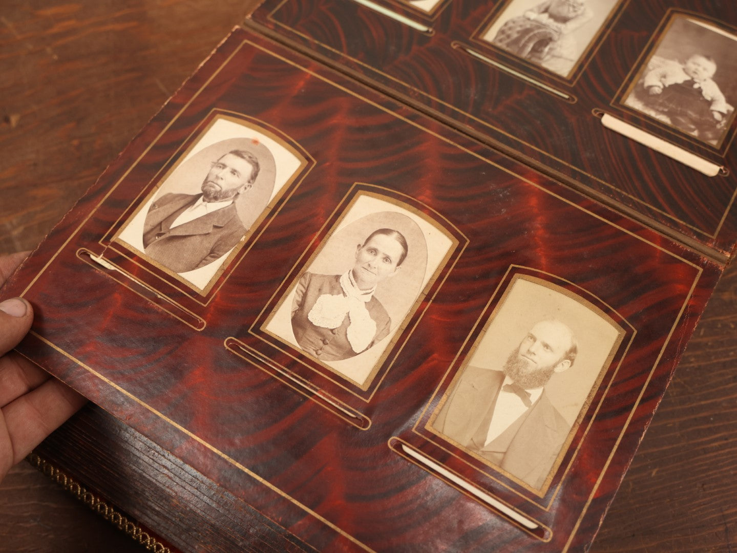 Lot 028 - Antique Family Photograph Album With Velvet Covering And Beveled Glass Heart Mirror, Containing 34 Cabinet Card Photos, 10 C.D.V.S, 1 Tintype, And 23 Paper Portrait Snapshots