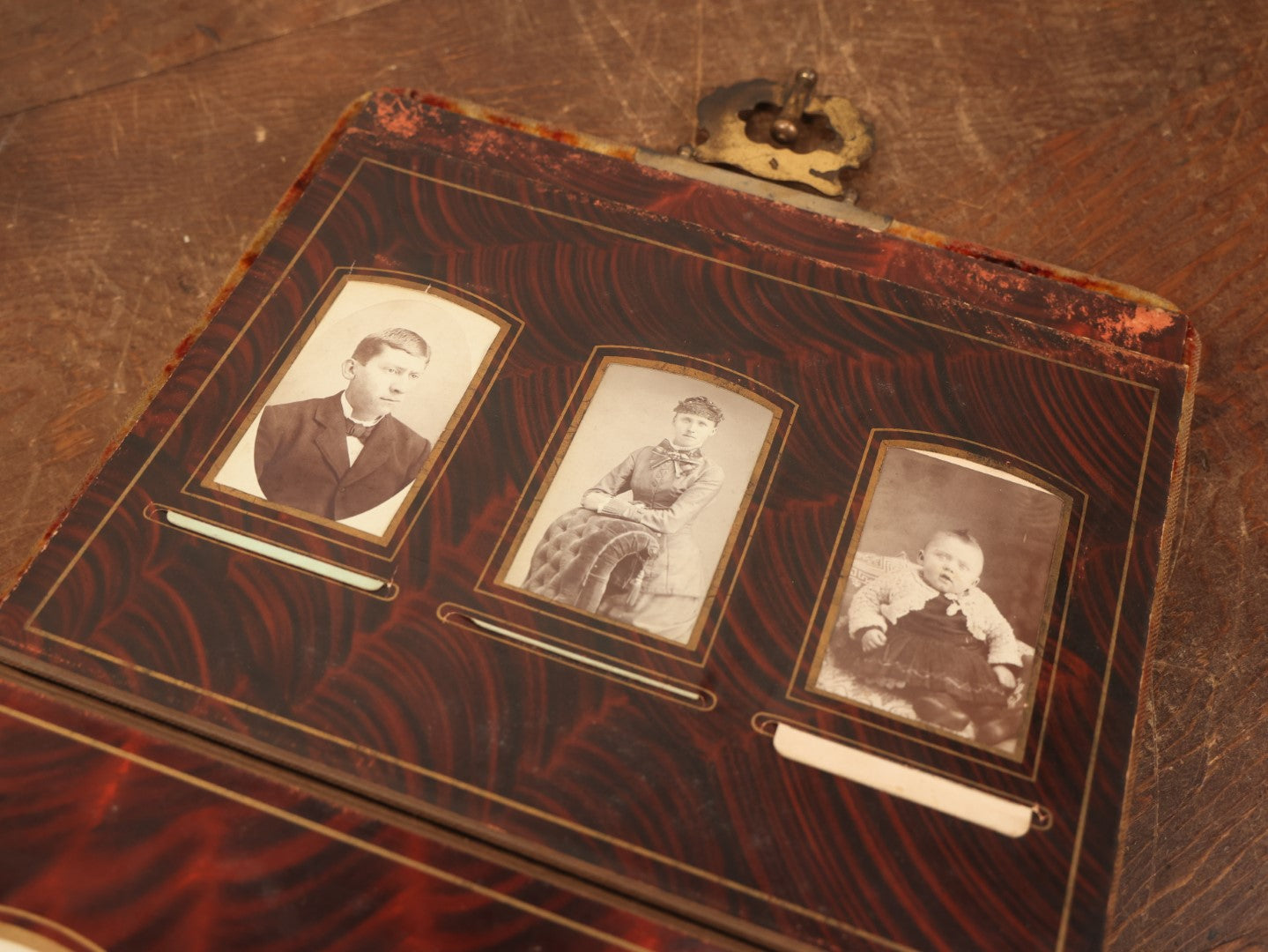 Lot 028 - Antique Family Photograph Album With Velvet Covering And Beveled Glass Heart Mirror, Containing 34 Cabinet Card Photos, 10 C.D.V.S, 1 Tintype, And 23 Paper Portrait Snapshots