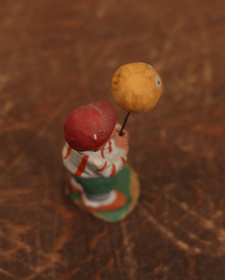 Lot 037 - Rare German Halloween Figurine, Papier Mache Or Bisque, Little Boy Holding Halloween Jack-O-Lantern J.O.L. Pumpkin Balloon