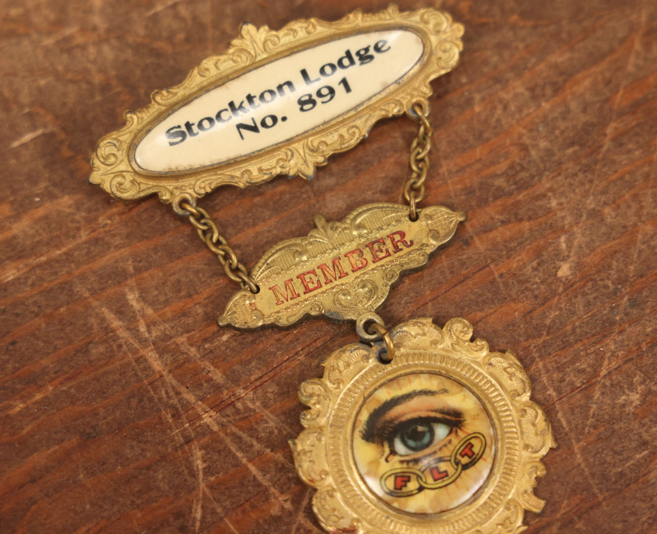 Lot 039 - Antique Odd Fellows I.O.O.F. Metal Member Badge, Stockton Lodge No. 81 With All Seeing Eye, Three Links, F.L.T., By The M.C. Lilley & Co., Columbus, Ohio