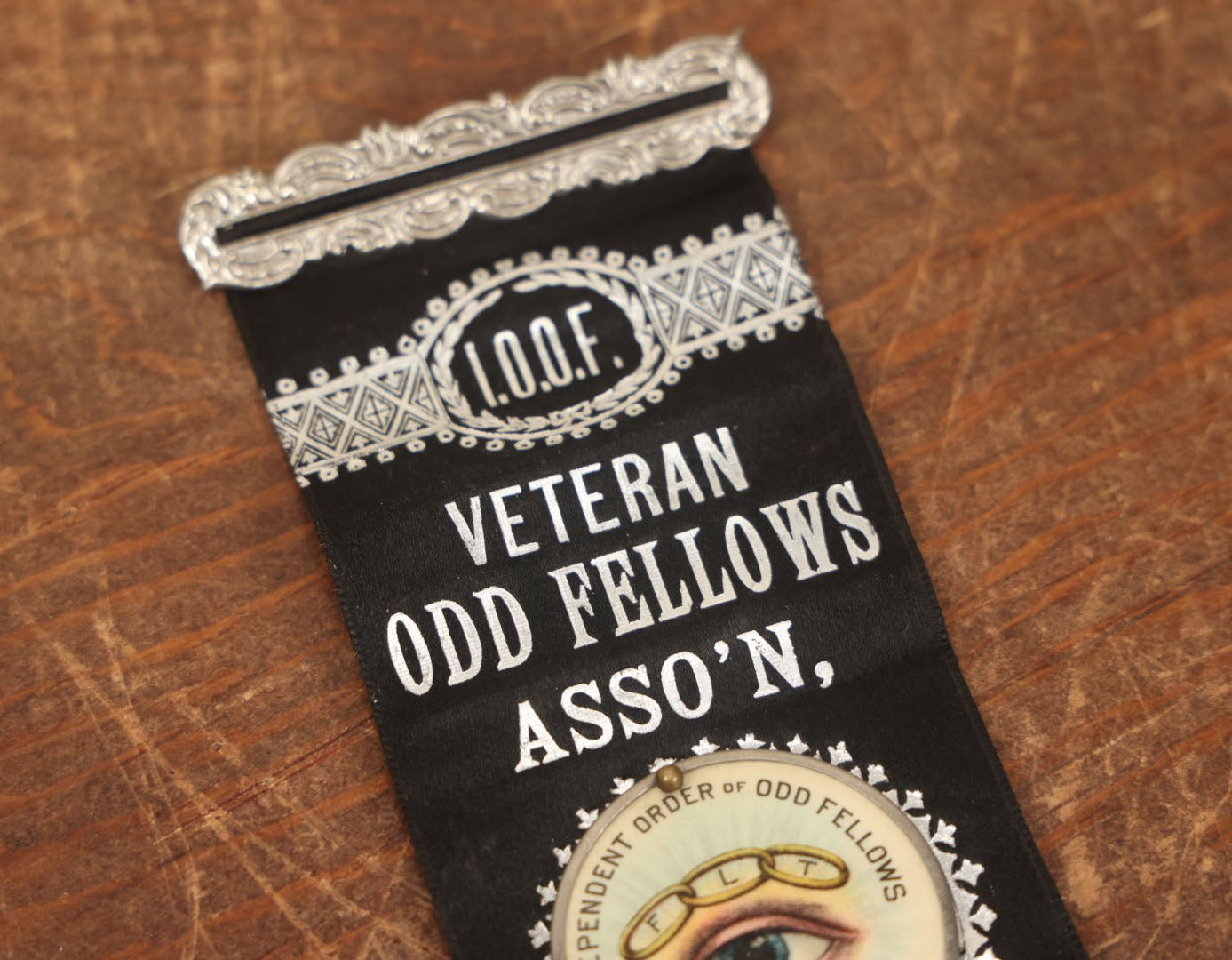 Lot 040 - Antique Odd Fellows I.O.O.F. Veteran Odd Fellows Association Ribbon And Badge, Sacramento, 1883, With All Seeing Eye, Three Links, F.L.T., By The Whitehead & Hoag Co., Newark, New Jersey