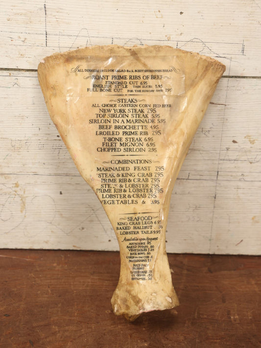 Lot 058 - Vintage Cow Scapula Menu Oddity, Menu Applied To Cow Bone, Steak, Prime Rib, And Roast Beef On Menu, Restaurant Decor