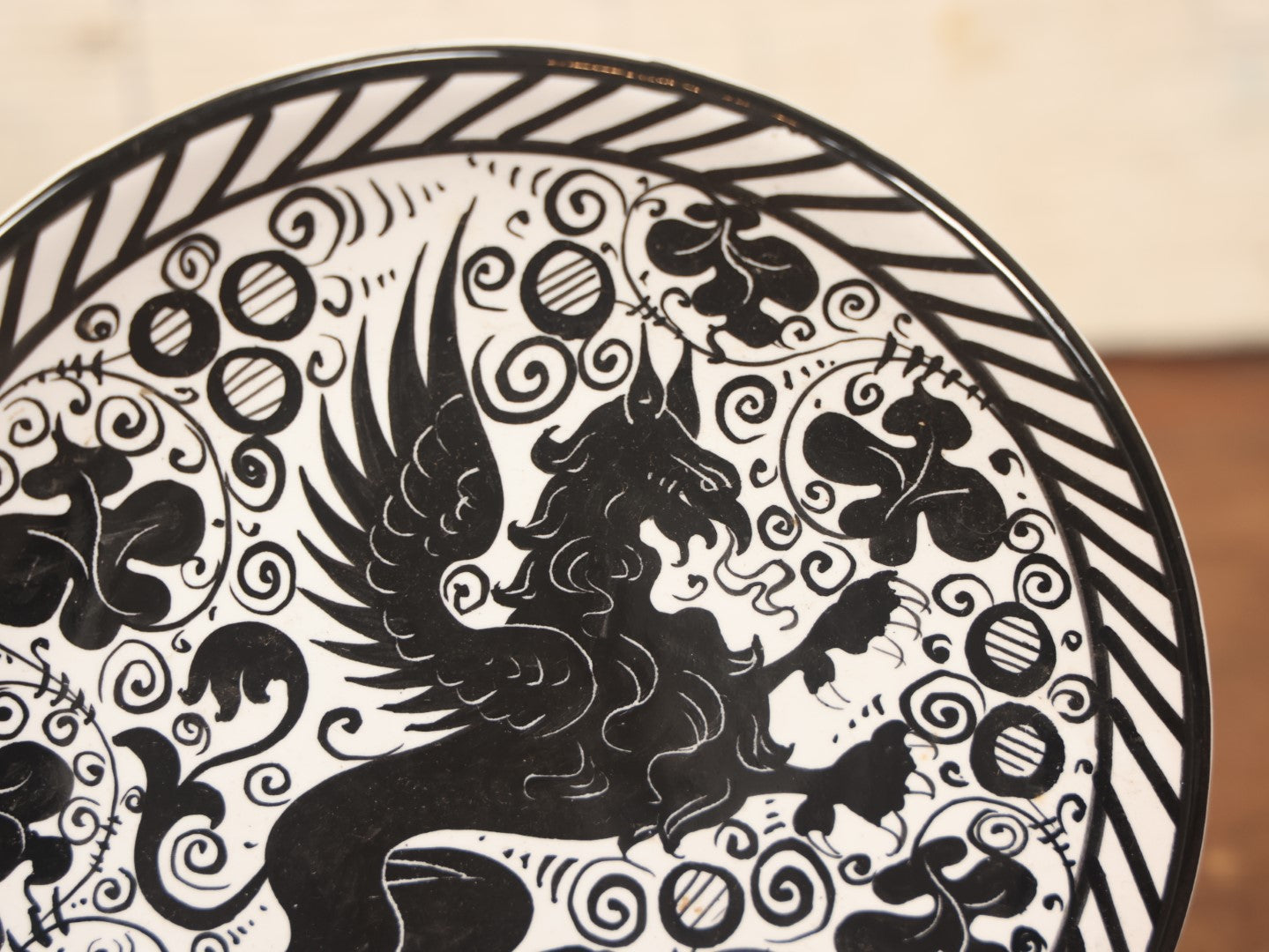 Lot 074 - Hand Painted Porcelain Gryffin Plate, Black On White, Signed Fima Deruta, Italy