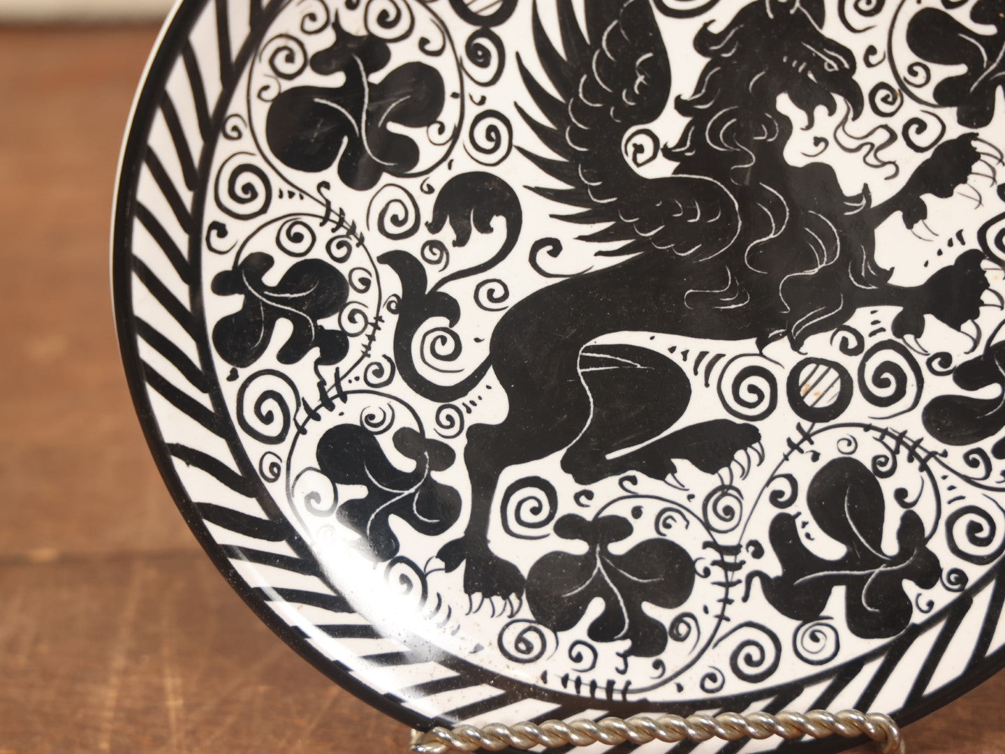 Lot 074 - Hand Painted Porcelain Gryffin Plate, Black On White, Signed Fima Deruta, Italy