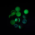 Lot 079 - Grouping Of 11 Uranium Glass And Other U.V. Blacklight Reactive Vintage And Antique Marbles