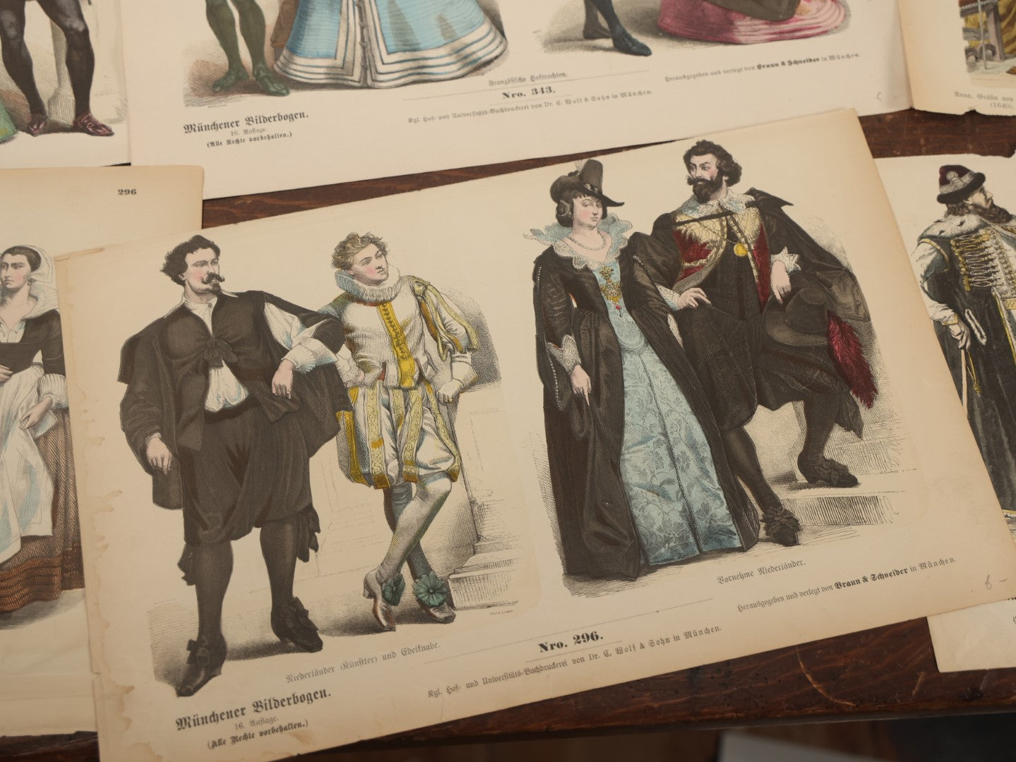 Lot 085 - Grouping Of Sixteen Antique German Hand Colored Lithograph Fashion Prints, From A Book, Including Nuns, Friars, And More, Note Various Wear And Tear