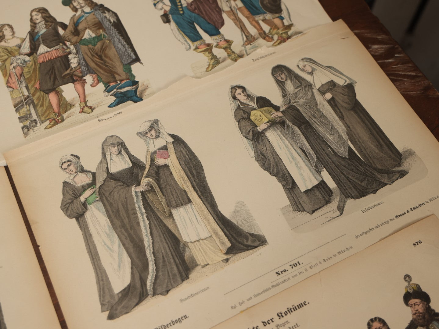 Lot 085 - Grouping Of Sixteen Antique German Hand Colored Lithograph Fashion Prints, From A Book, Including Nuns, Friars, And More, Note Various Wear And Tear