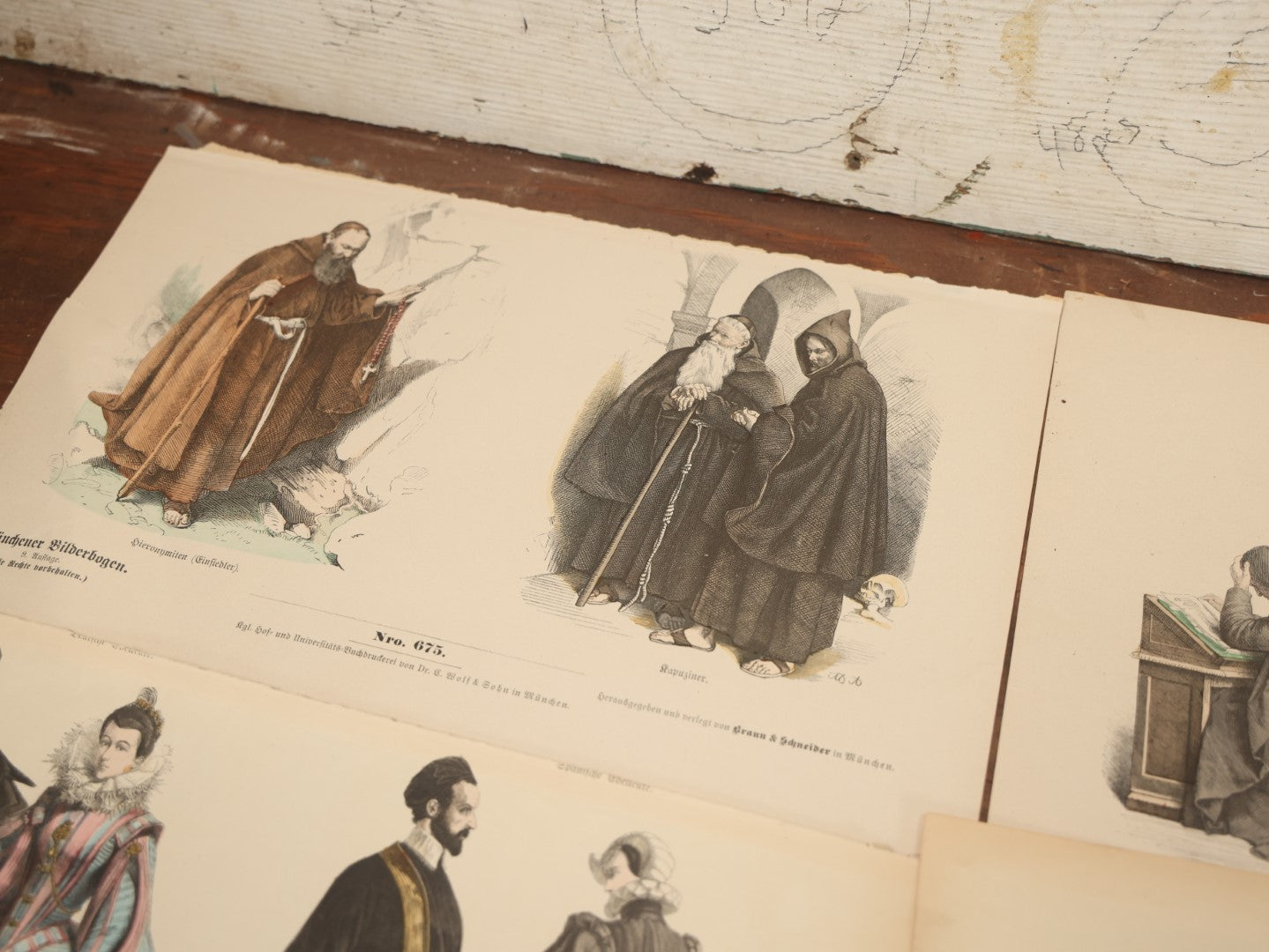 Lot 085 - Grouping Of Sixteen Antique German Hand Colored Lithograph Fashion Prints, From A Book, Including Nuns, Friars, And More, Note Various Wear And Tear