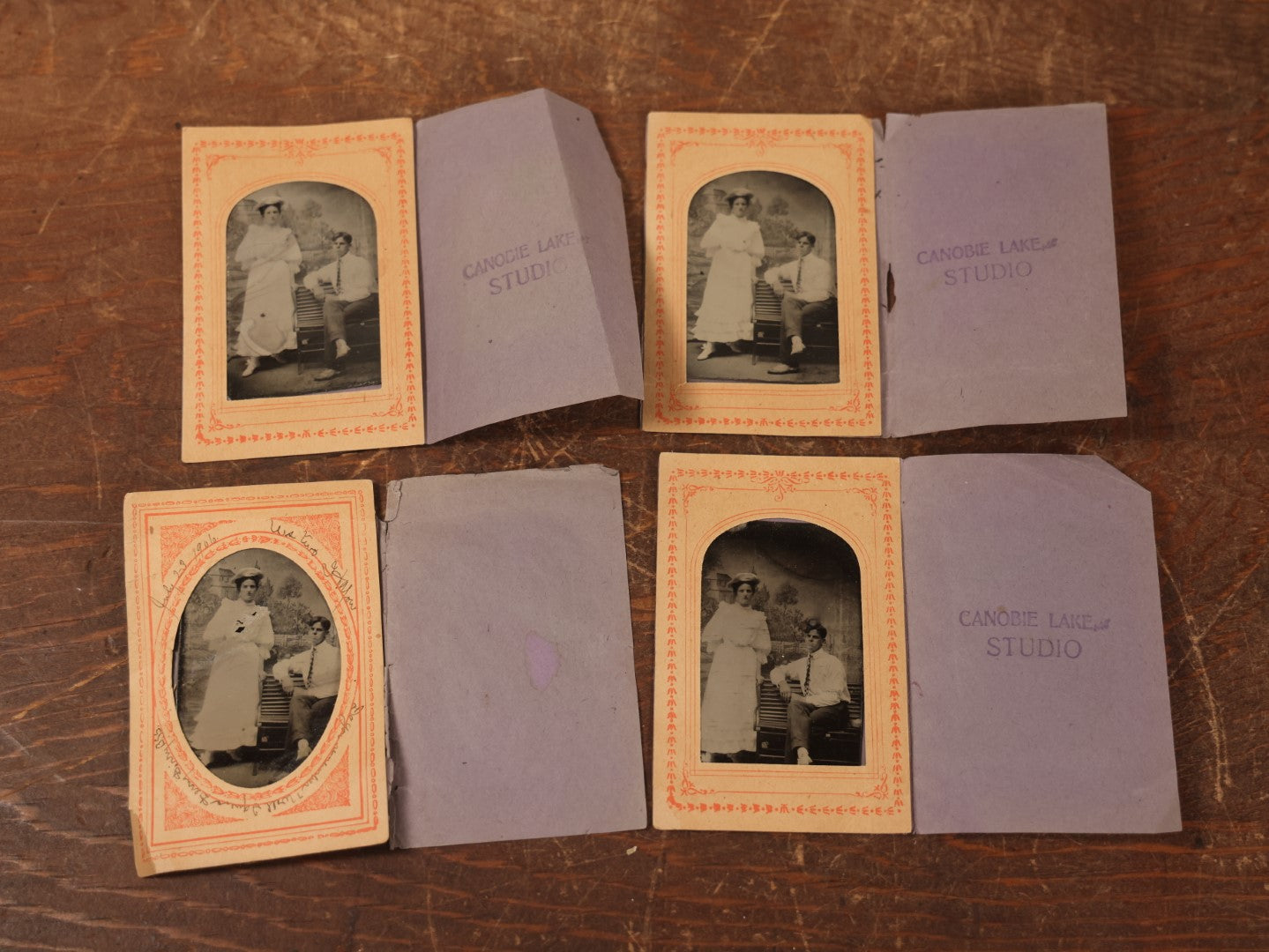 Lot 088 - Grouping Of Four Duplicate Tintypes Of Couple In Paper Folders From Canobie Lake Studio, New Hampshire